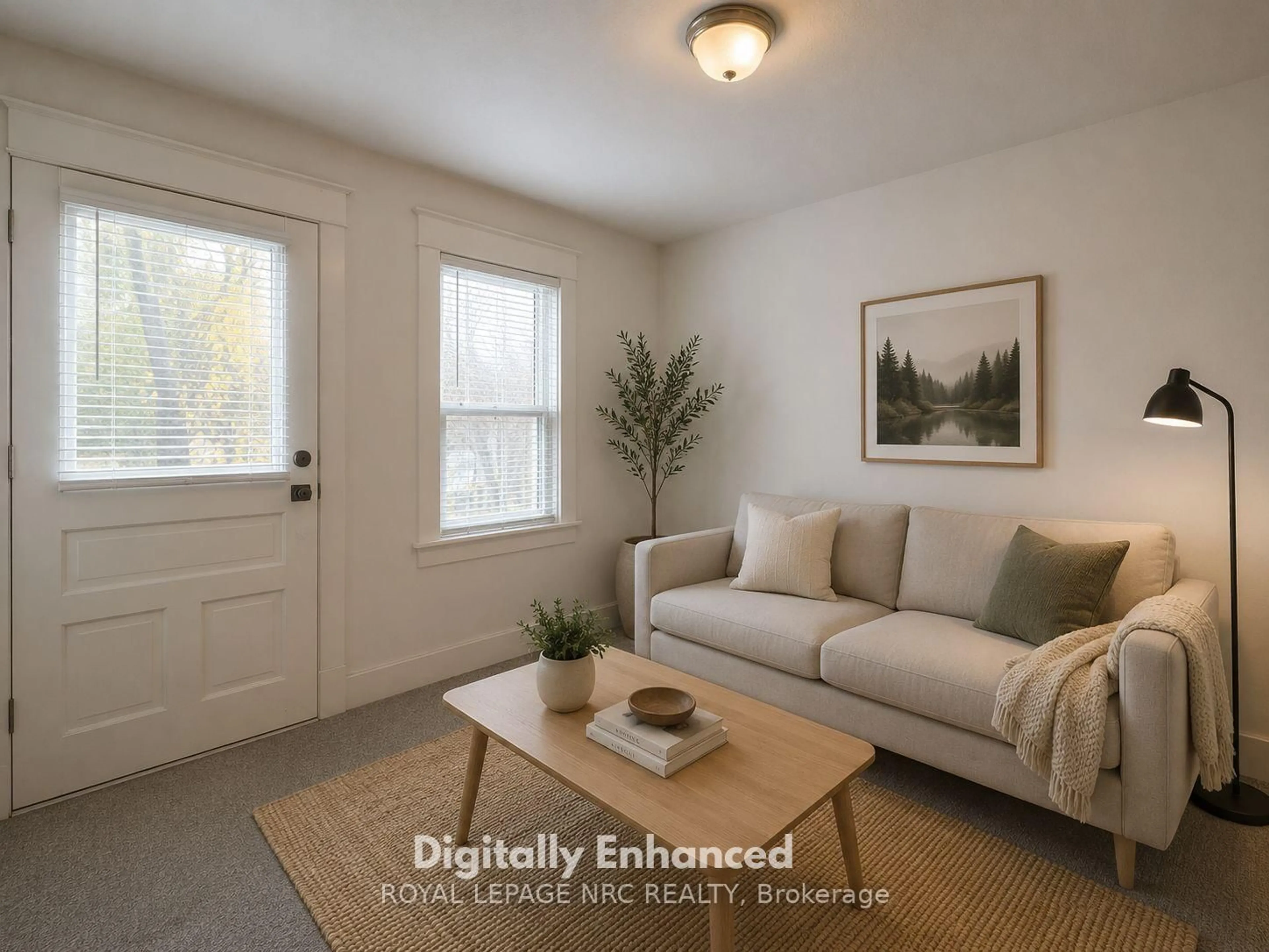 Living room with furniture, wood/laminate floor for 39 Manchester Ave, St. Catharines Ontario L2R 1N9