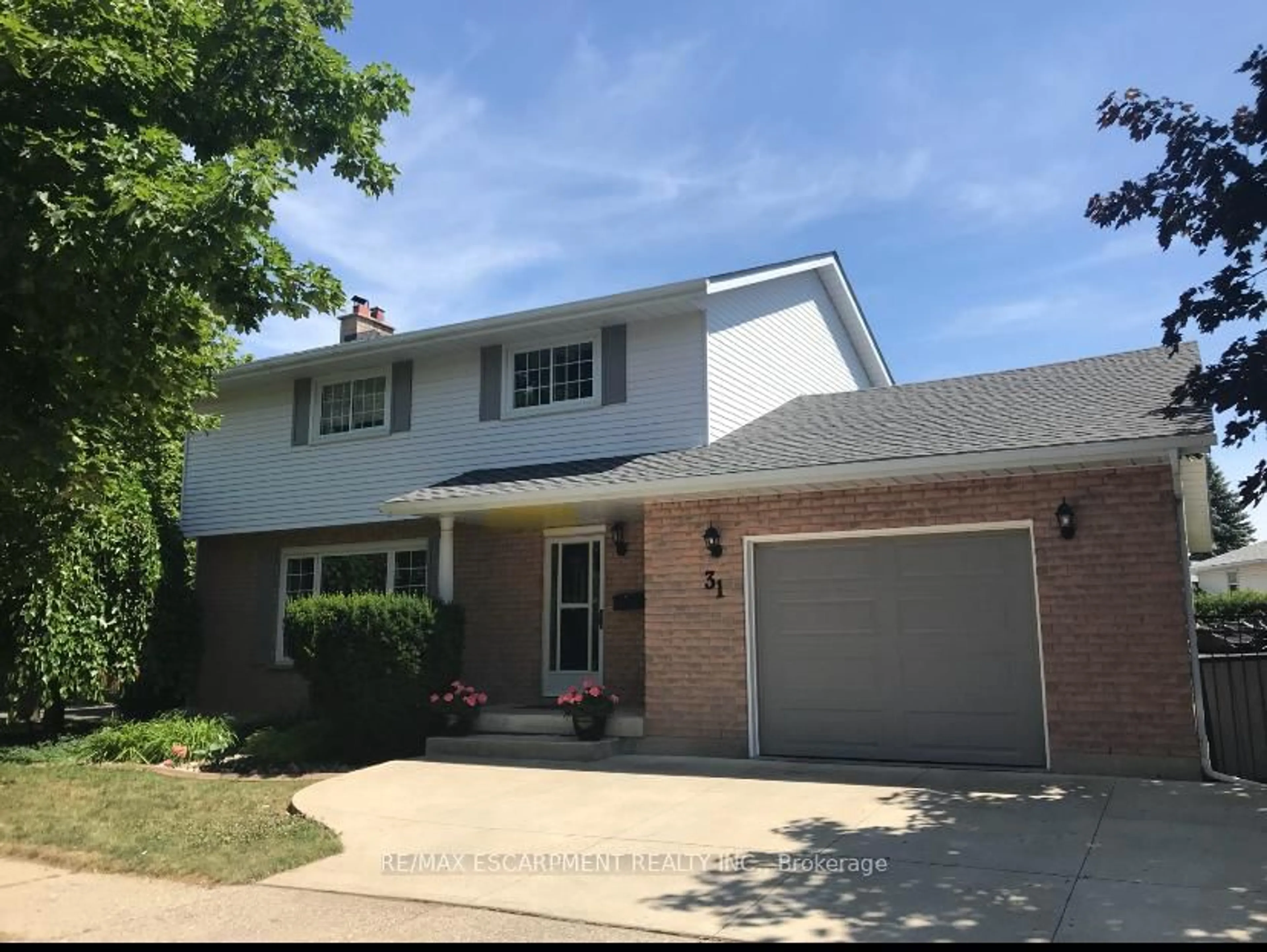 Home with vinyl exterior material, street for 31 Blackfriar Lane, Brantford Ontario N3R 7M2
