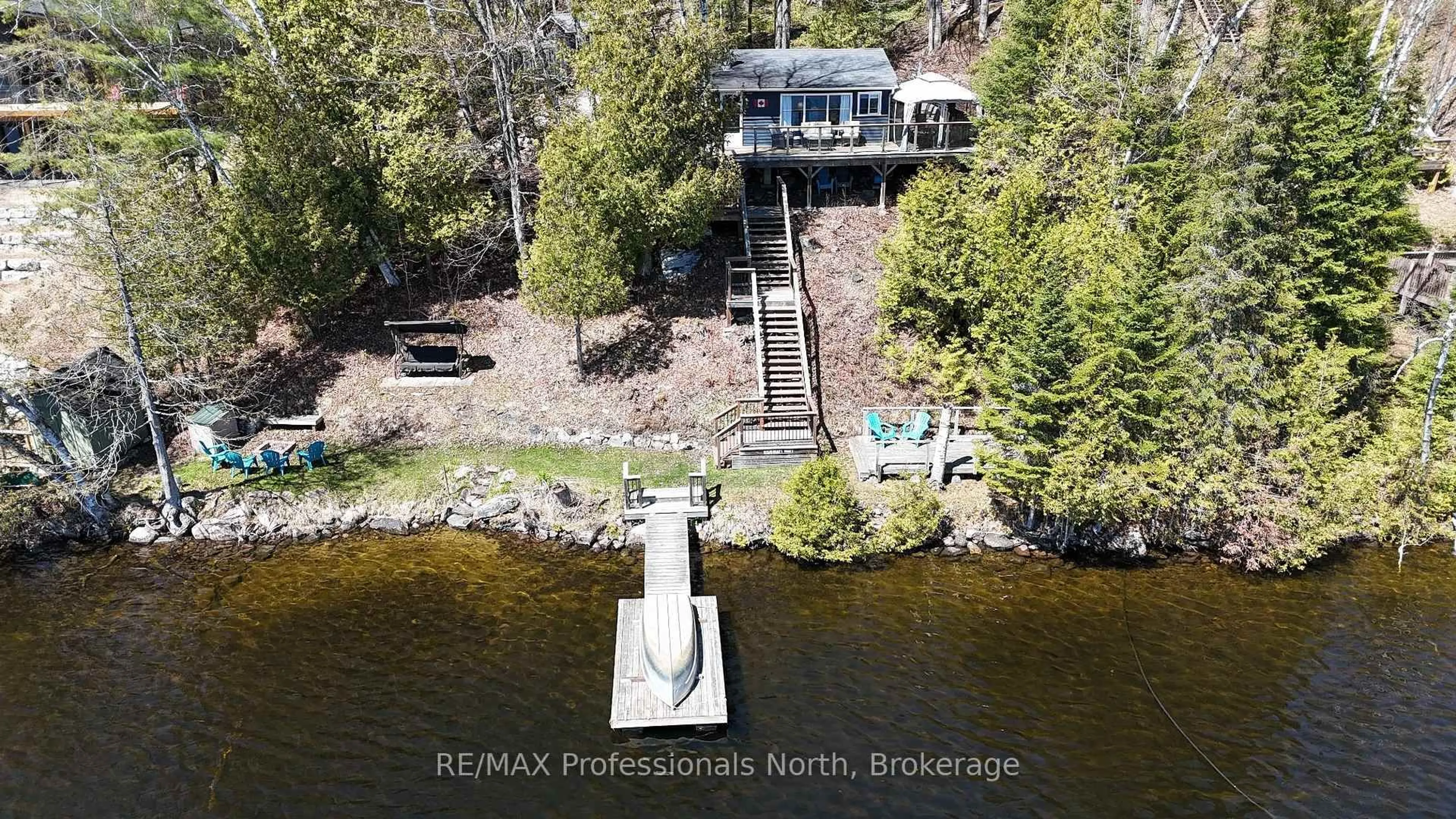 A pic from outside/outdoor area/front of a property/back of a property/a pic from drone, water/lake/river/ocean view for 1080 Heart's Content Dr, Highlands East Ontario K0M 1X0