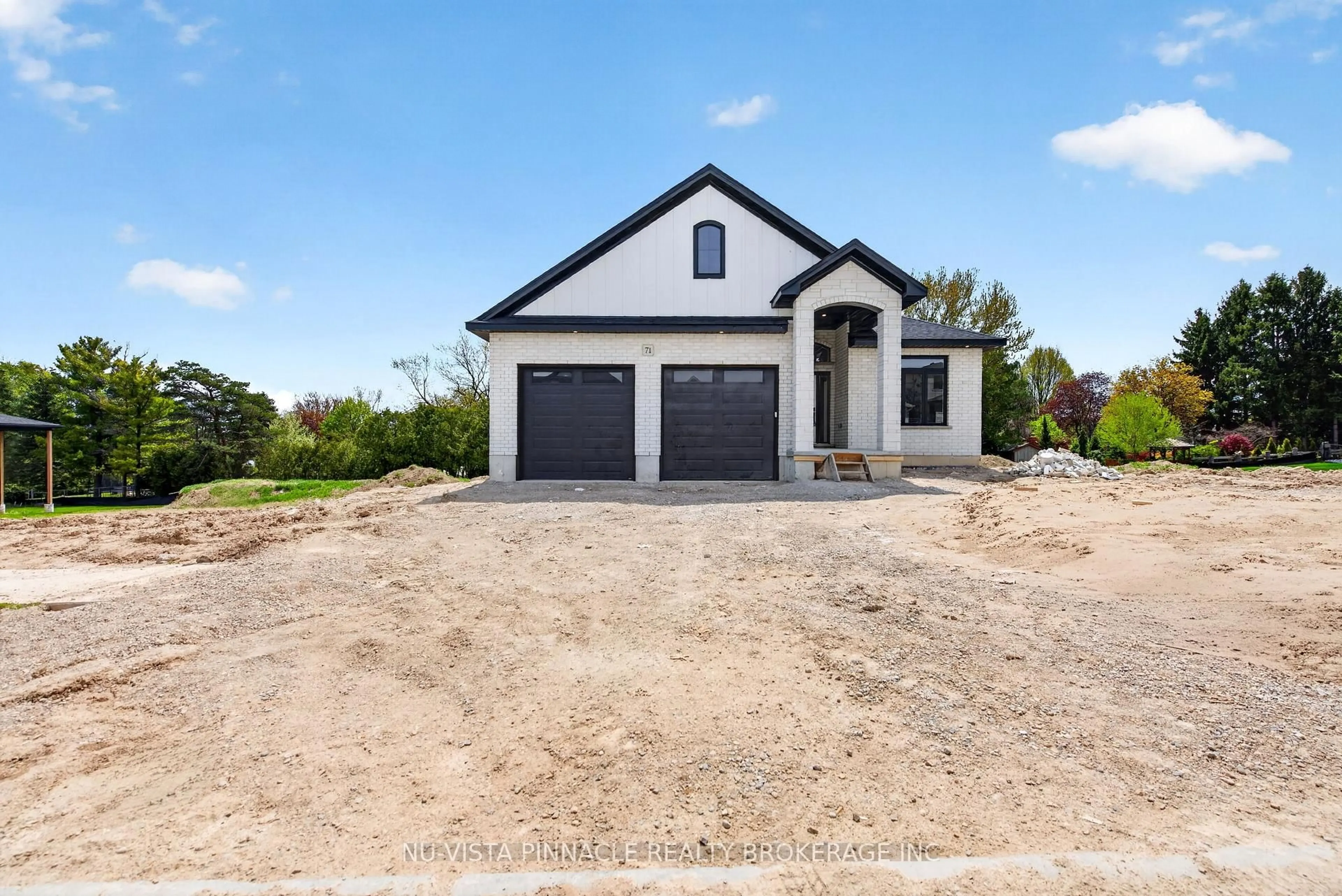 Home with brick exterior material, street for 71 Basil Cres, Middlesex Centre Ontario N0M 2A0