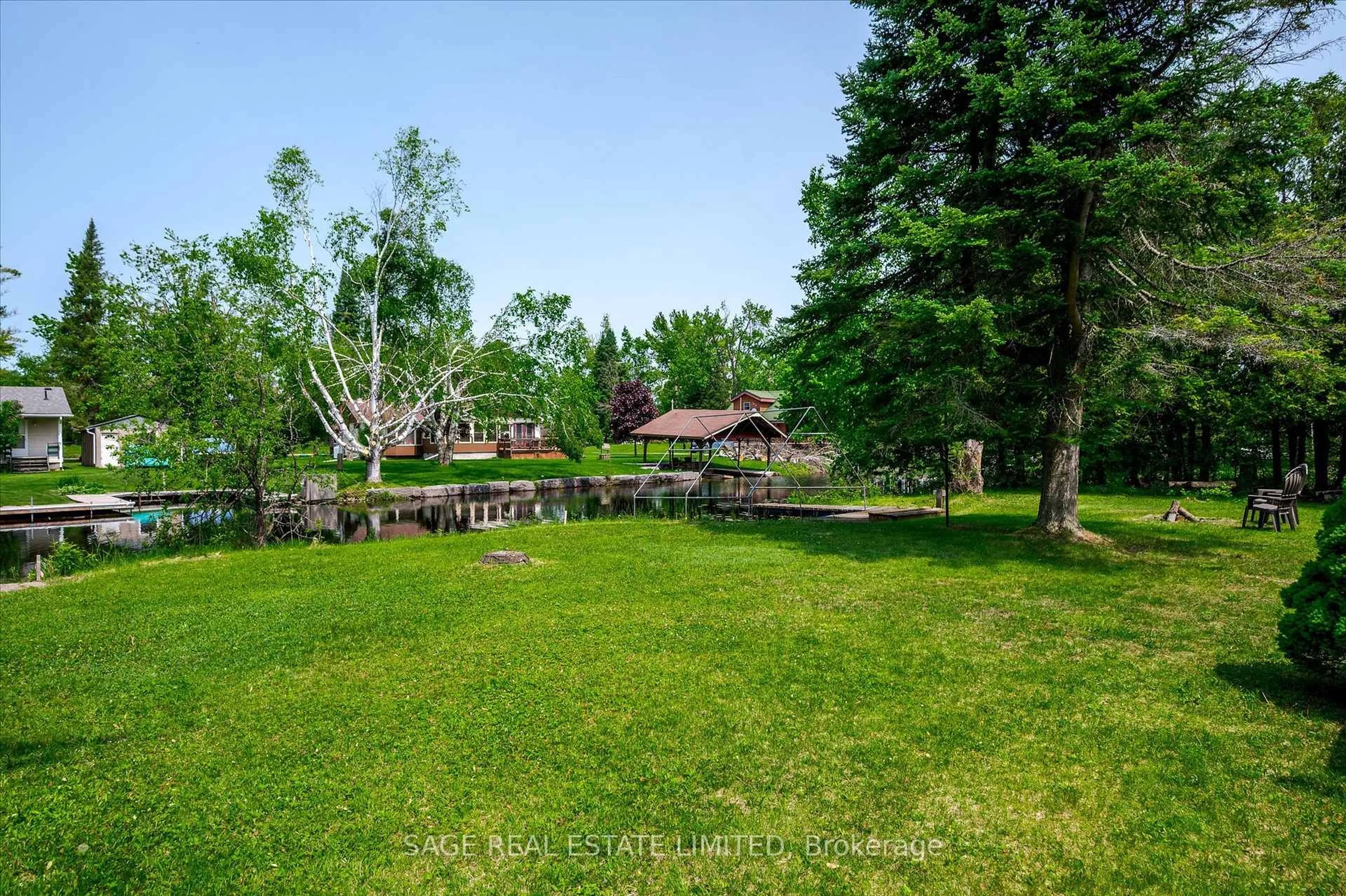 A pic from outside/outdoor area/front of a property/back of a property/a pic from drone, forest/trees view for 33 Fire Route 104, Trent Lakes Ontario K0M 1A0