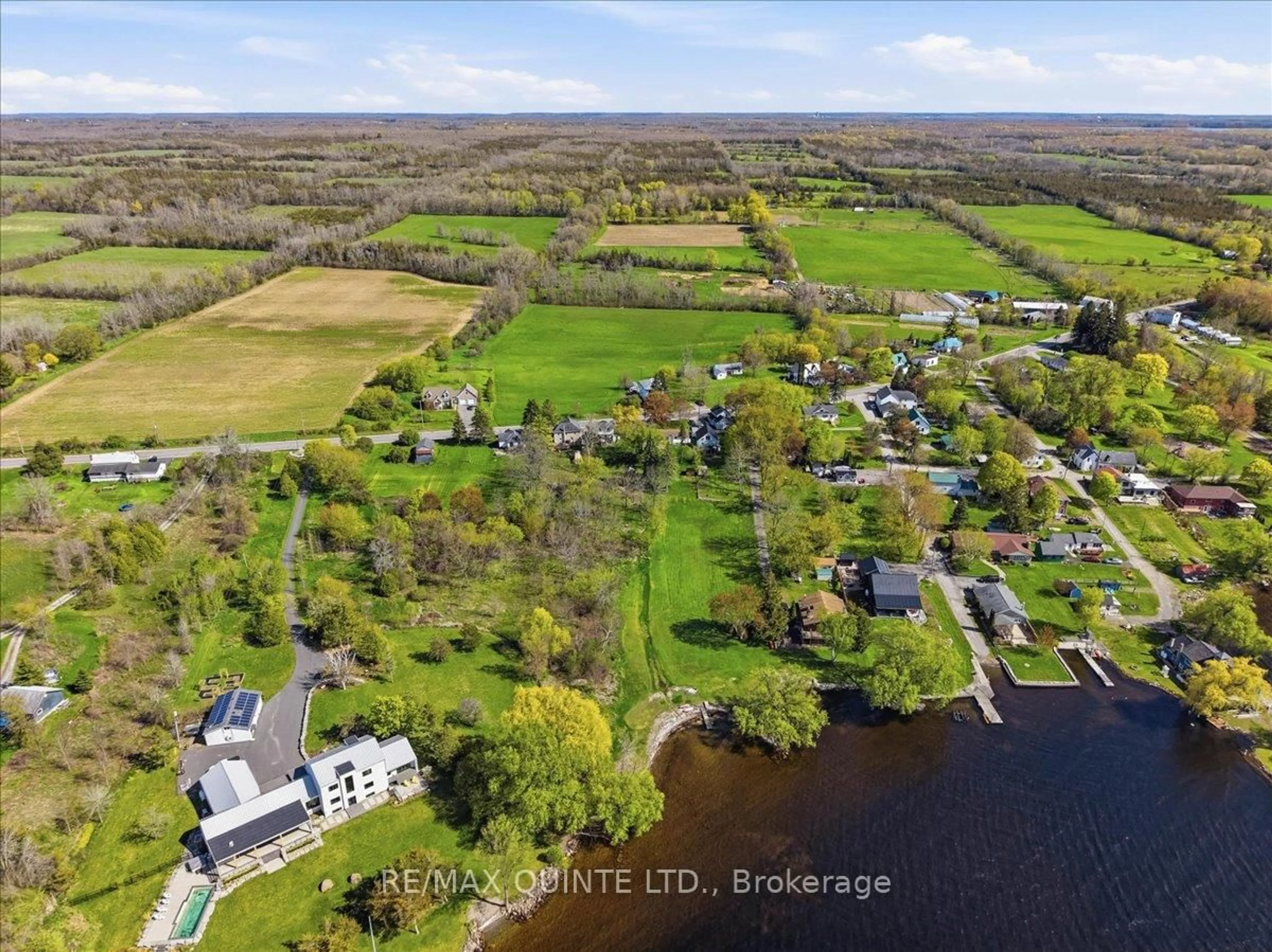 A pic from outside/outdoor area/front of a property/back of a property/a pic from drone, water/lake/river/ocean view for 1467 County Rd 15 Rd, Prince Edward County Ontario K0K 1W0