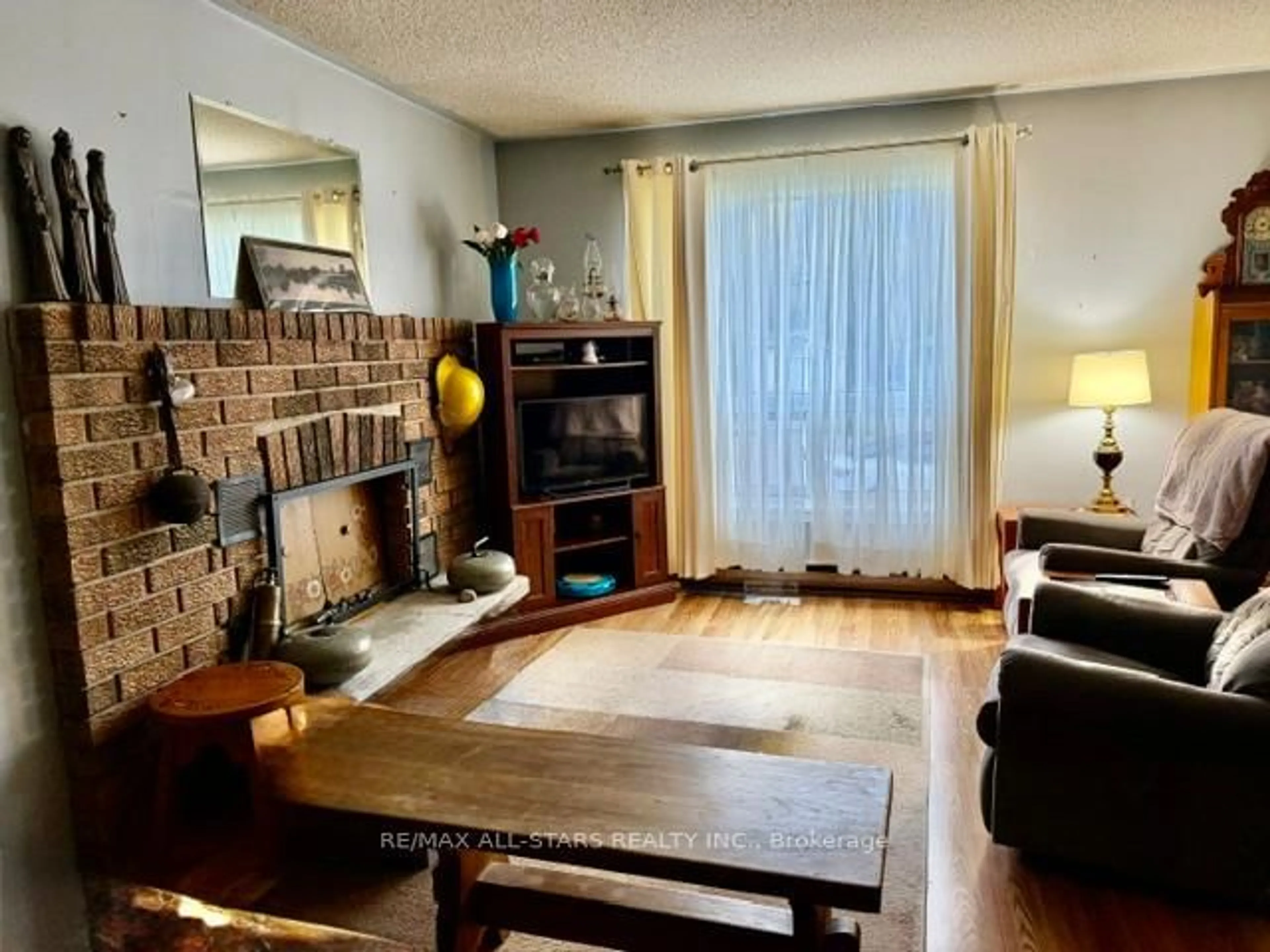 Living room with furniture, wood/laminate floor for 16 Dunn St, Kawartha Lakes Ontario K0M 1A0
