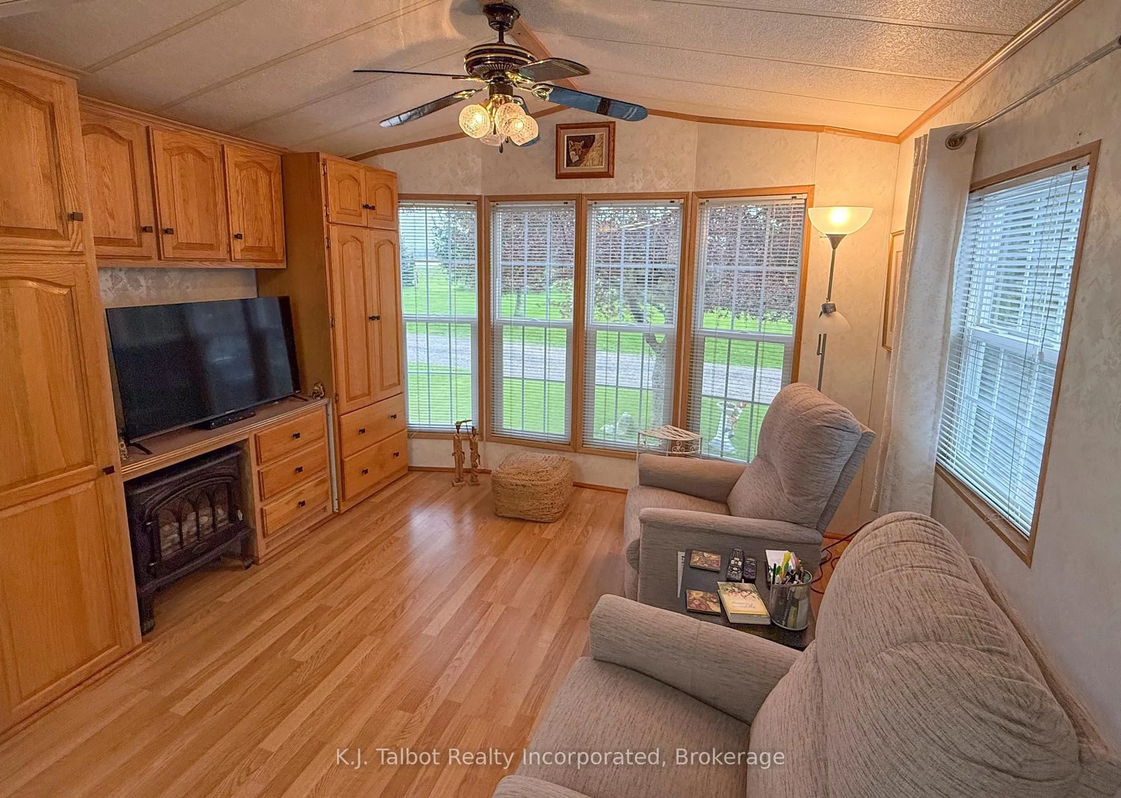 Living room with furniture, wood/laminate floor for 77719 Bluewater Highway #45 Portside Drive N, Bluewater Ontario N0M 1G0