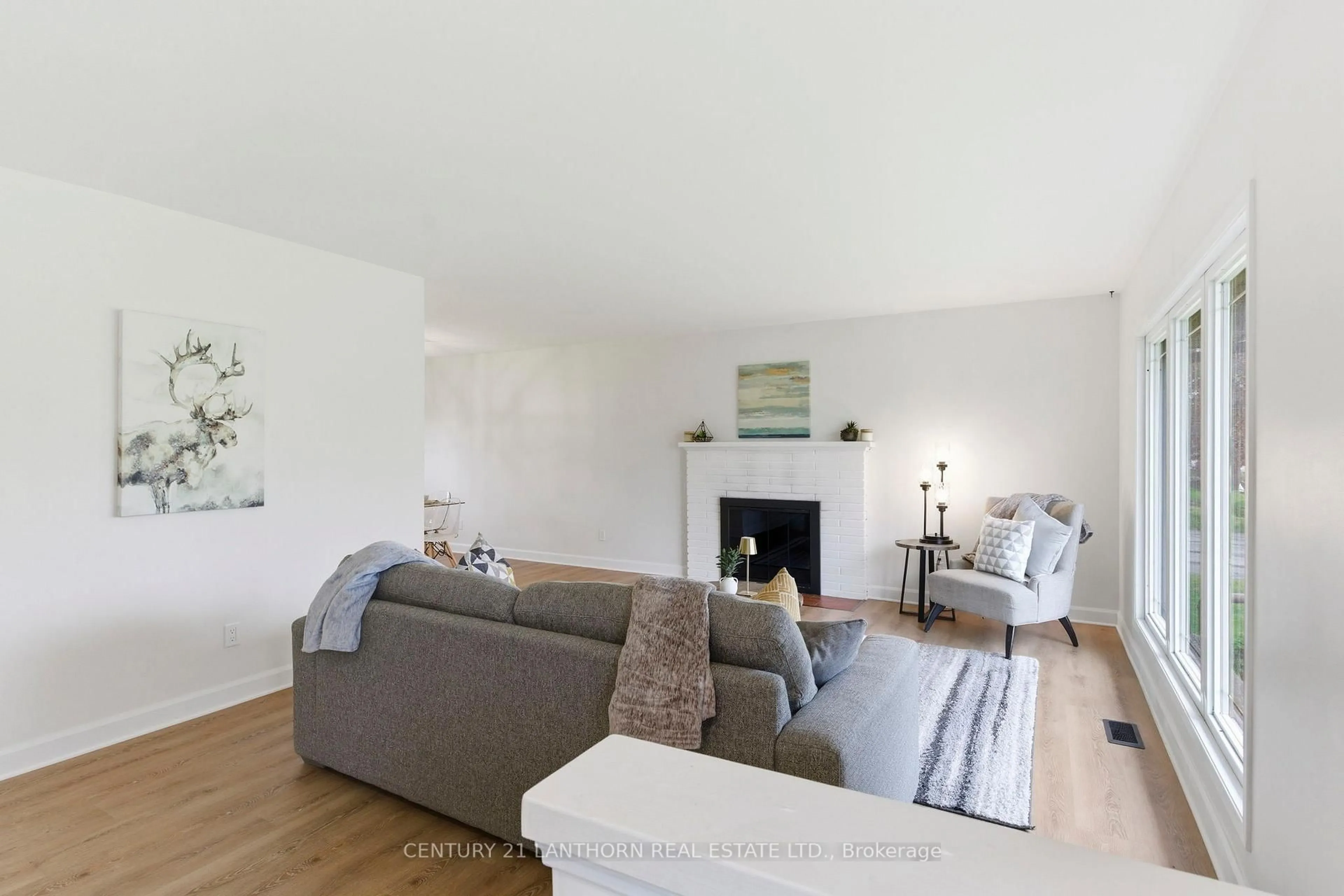 Living room with furniture, wood/laminate floor for 3517 Charleville Rd, Augusta Ontario K0E 1T0