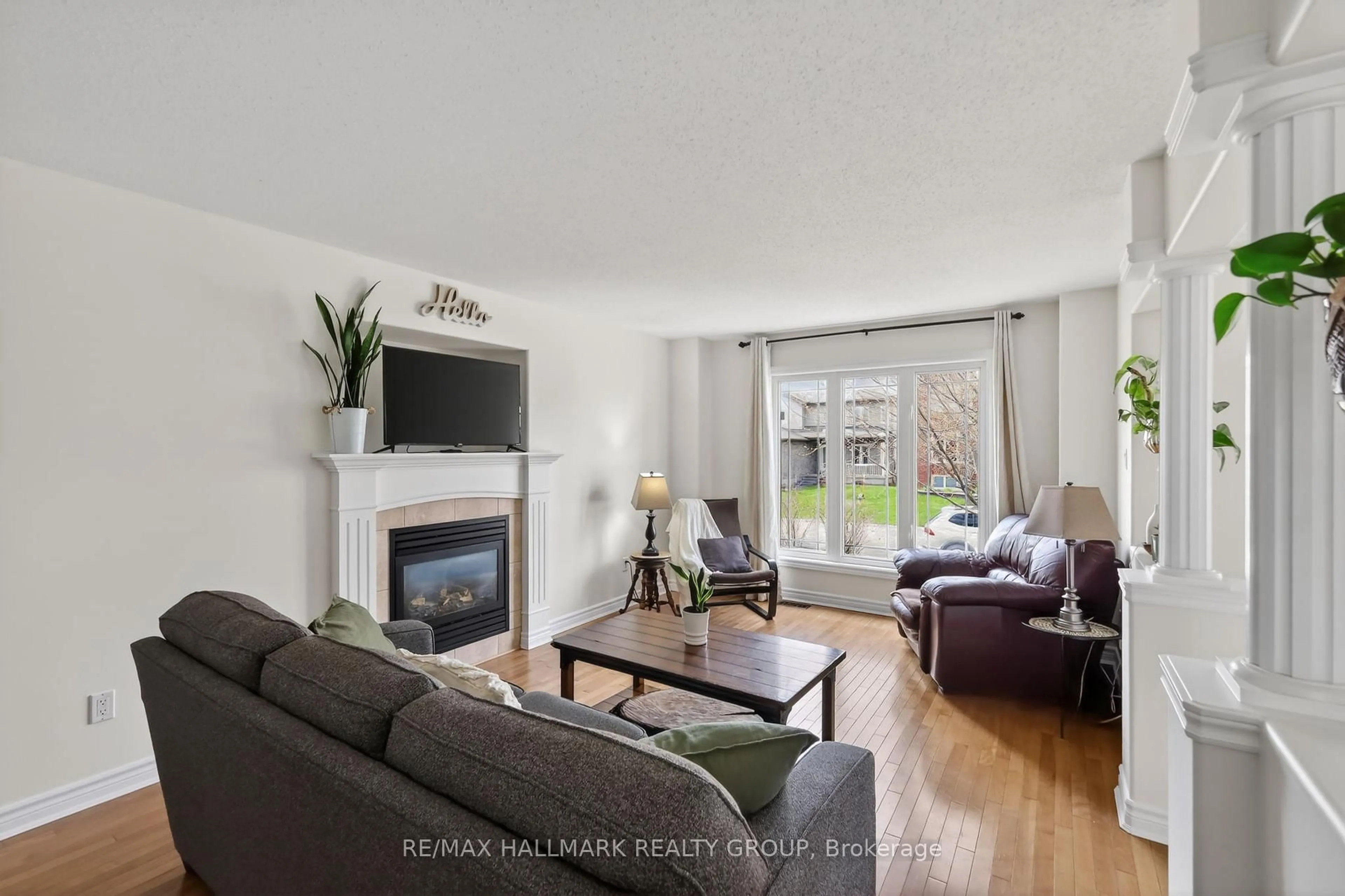 Living room with furniture, wood/laminate floor for 15 Manoir St, Russell Ontario K0A 1W0