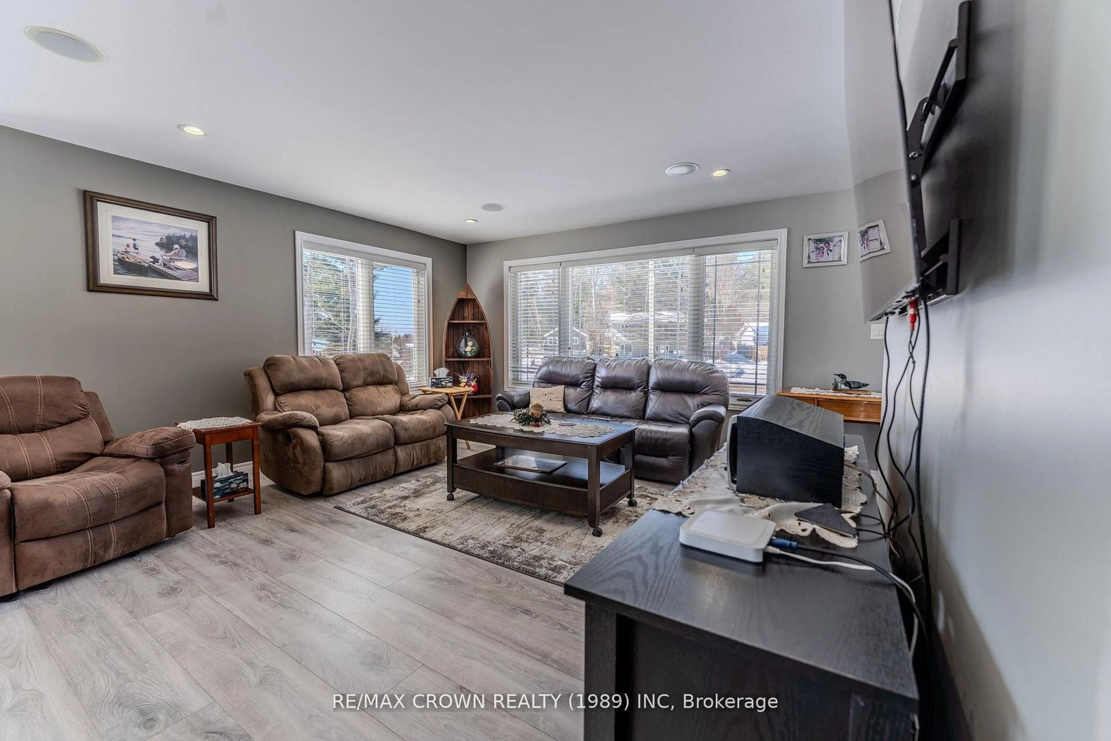 Living room with furniture, wood/laminate floor for 211 Eglington Rd, East Ferris Ontario P0H 1H0