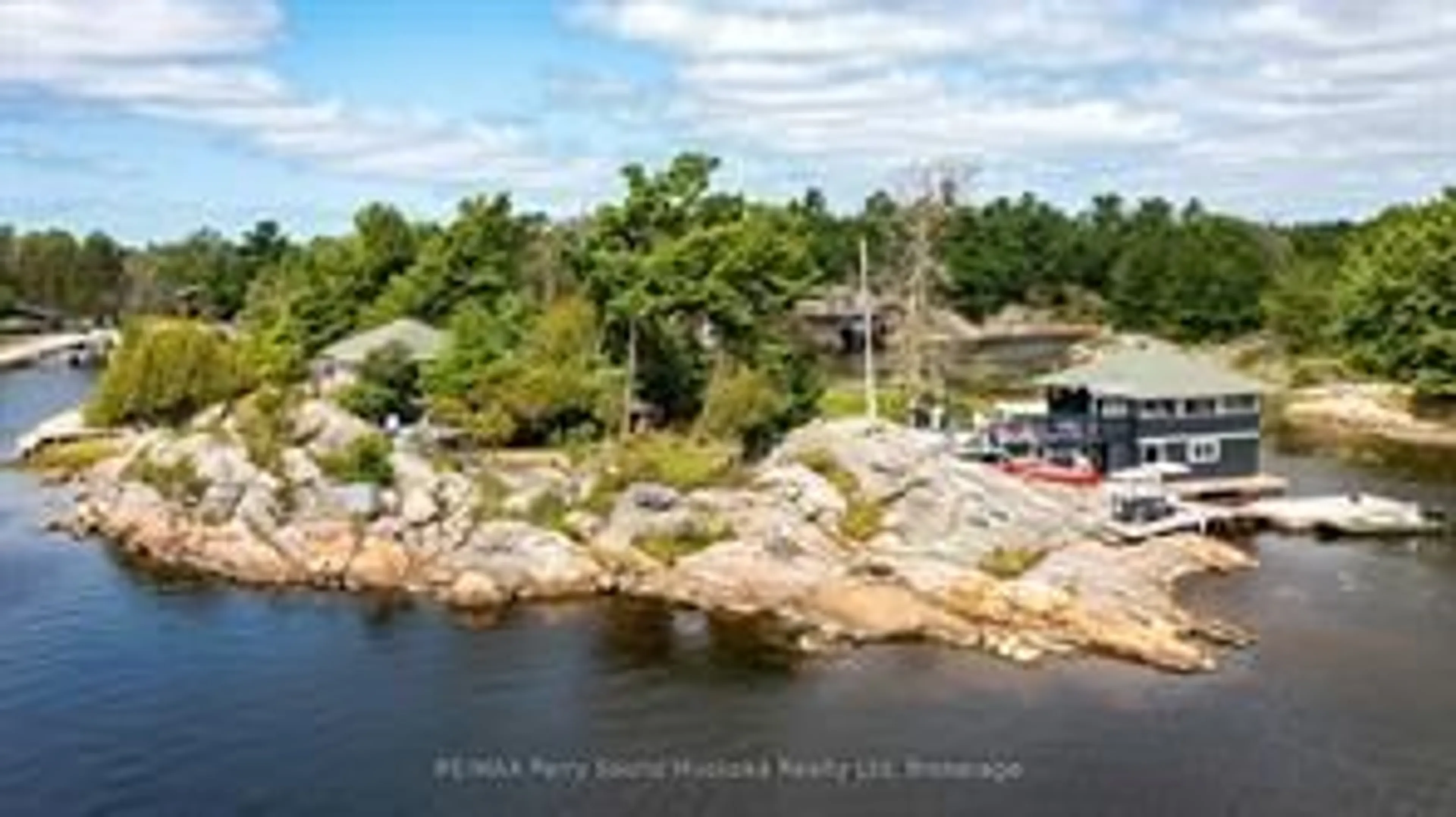 A pic from outside/outdoor area/front of a property/back of a property/a pic from drone, water/lake/river/ocean view for 1 Island 271c, Carling Ontario P0G 1G0