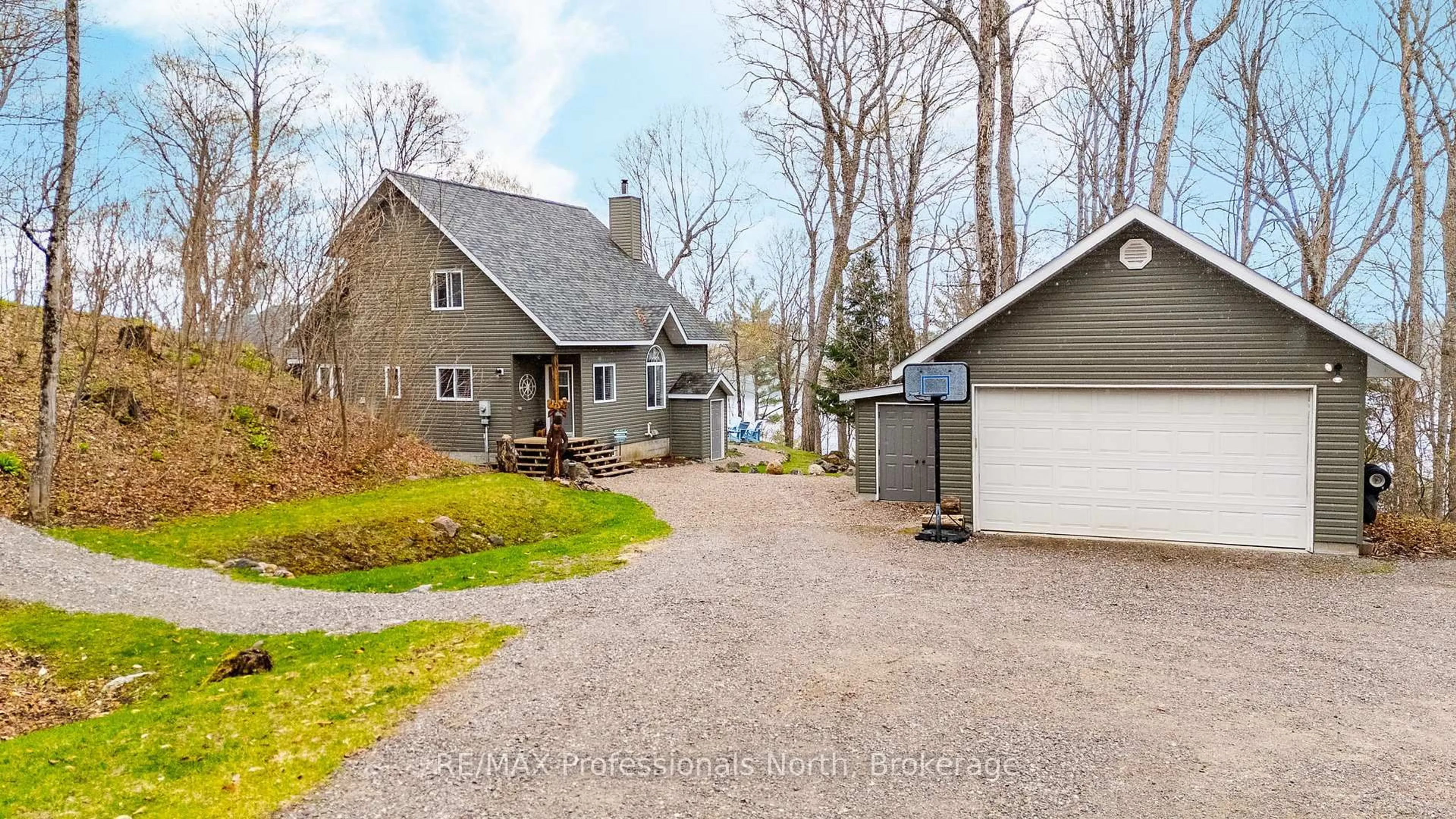 A pic from outside/outdoor area/front of a property/back of a property/a pic from drone, street for 3179 Trappers Tr, Dysart et al Ontario K0M 1S0