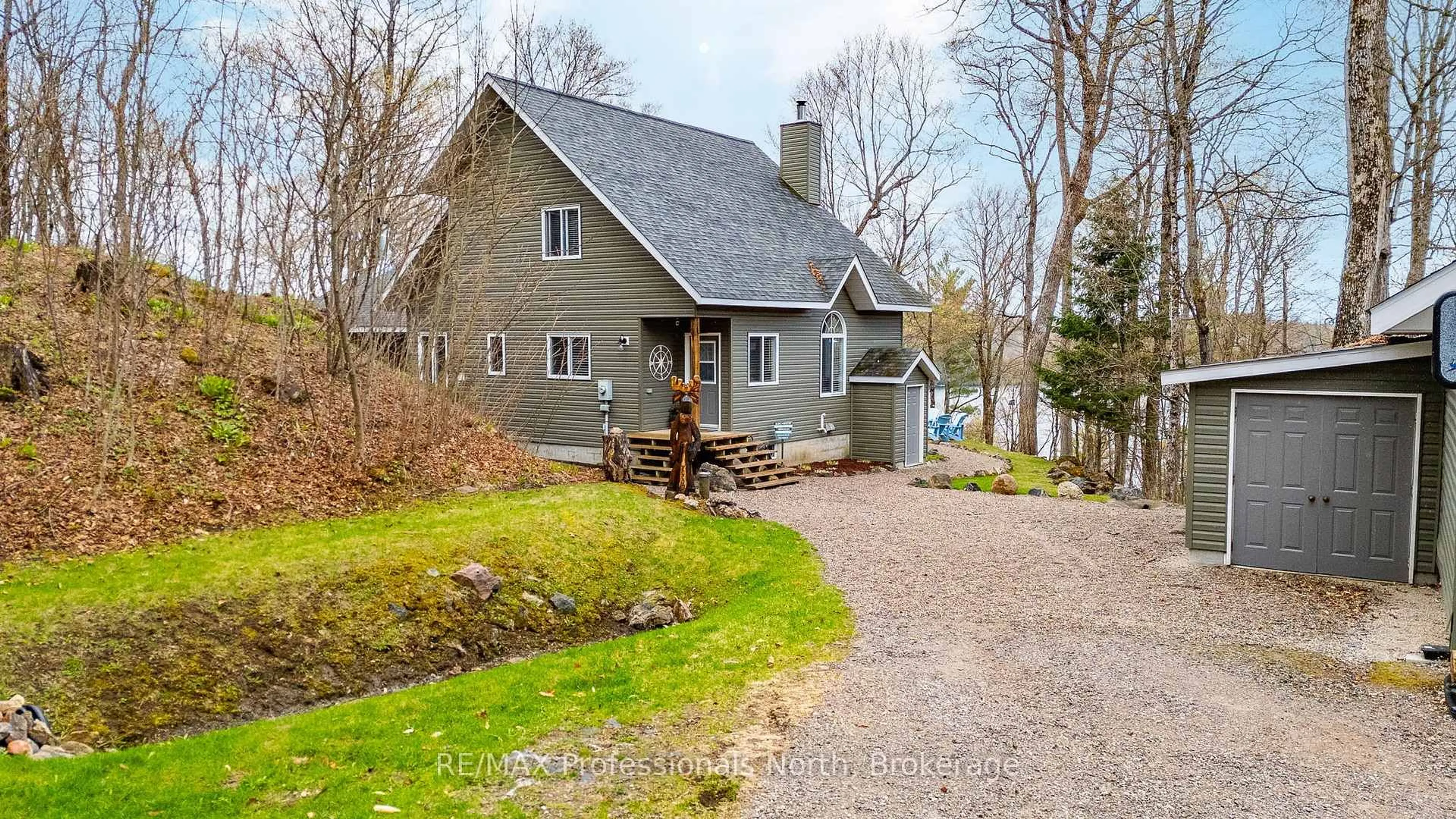 A pic from outside/outdoor area/front of a property/back of a property/a pic from drone, street for 3179 Trappers Tr, Dysart et al Ontario K0M 1S0