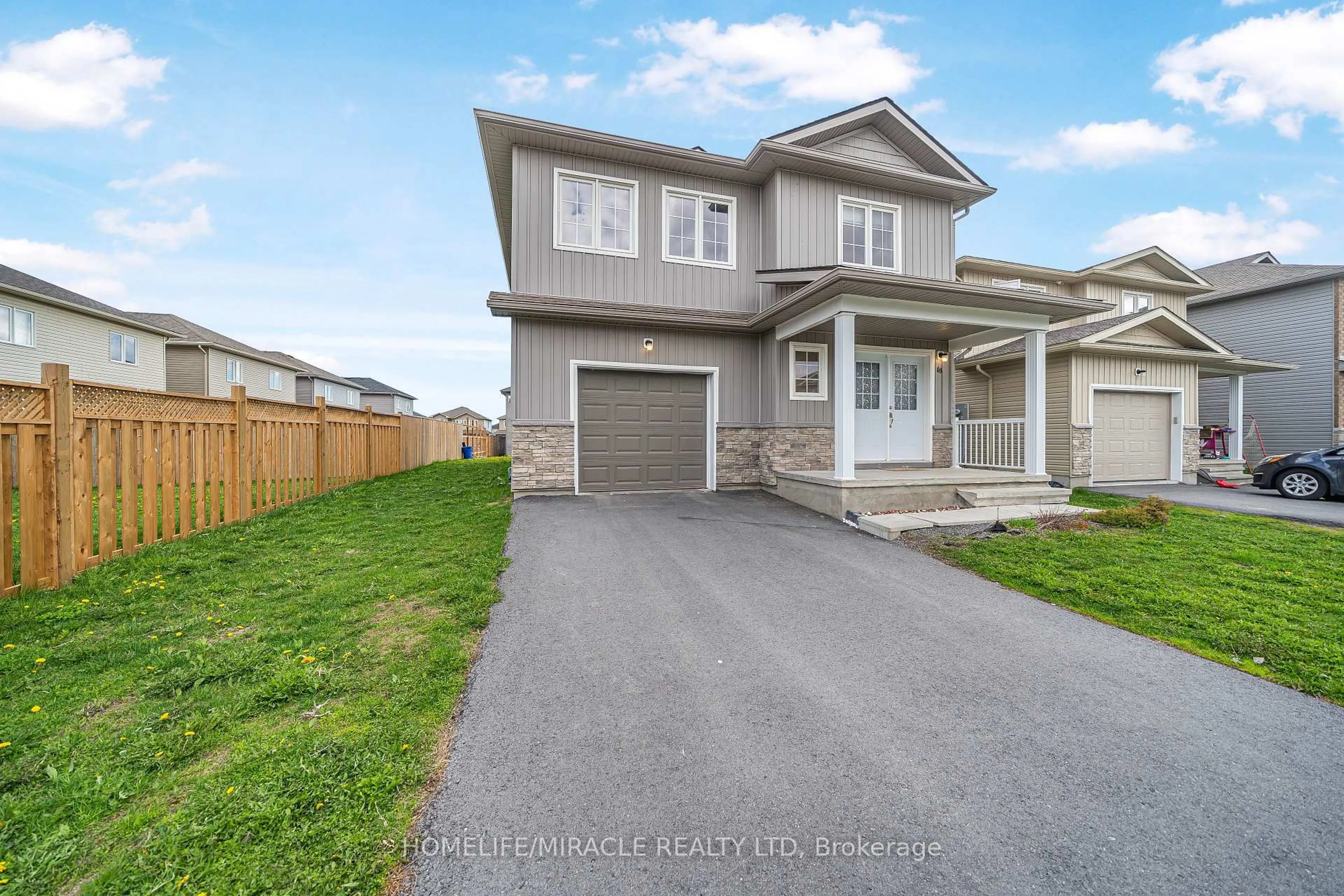 A pic from outside/outdoor area/front of a property/back of a property/a pic from drone, street for 63 Brennan Cres, Bissett Creek Ontario K0H 2H0