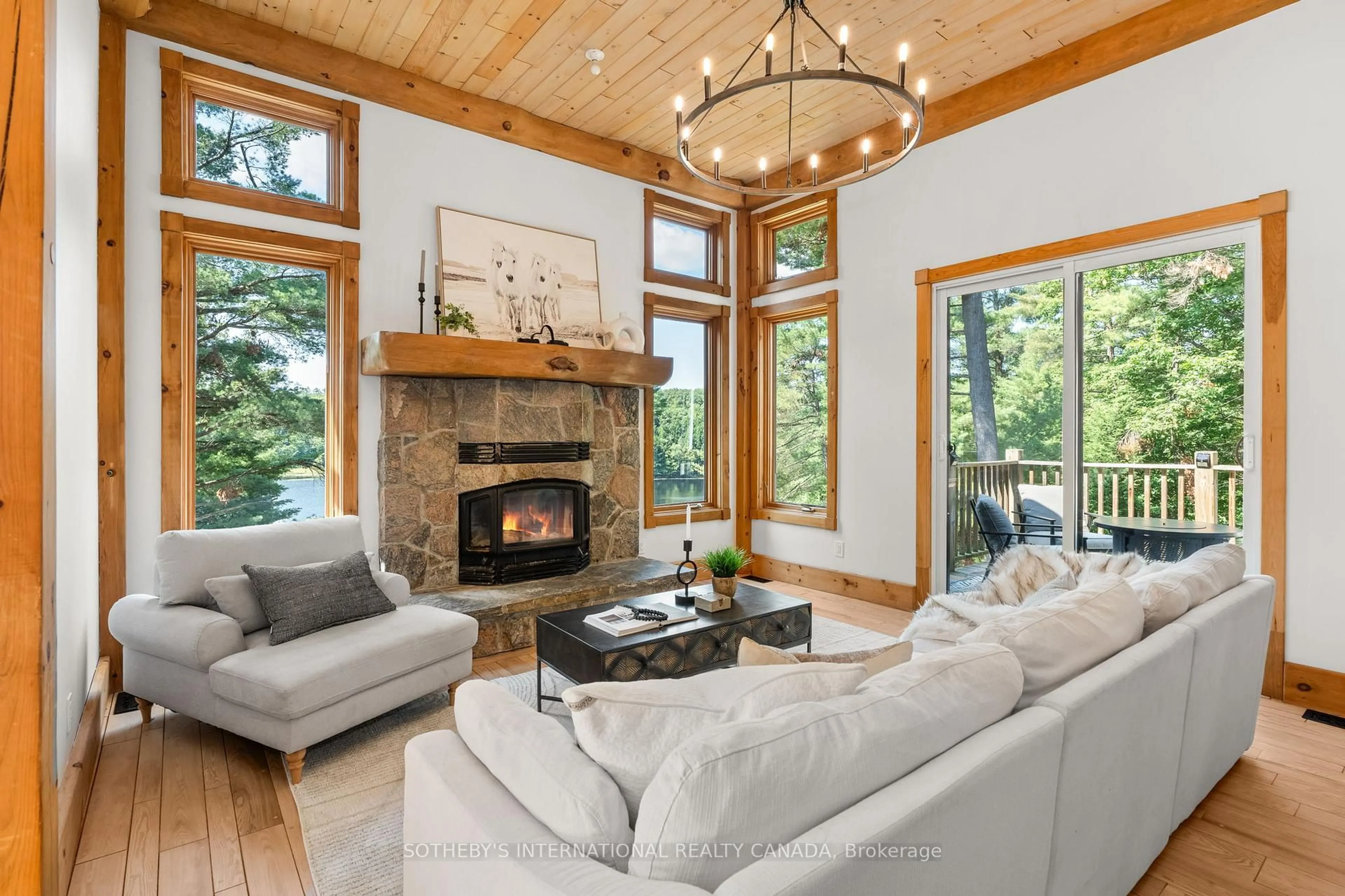 Living room with furniture, wood/laminate floor for 49 Estates Dr, Muskoka Lakes Ontario P0B 1J0