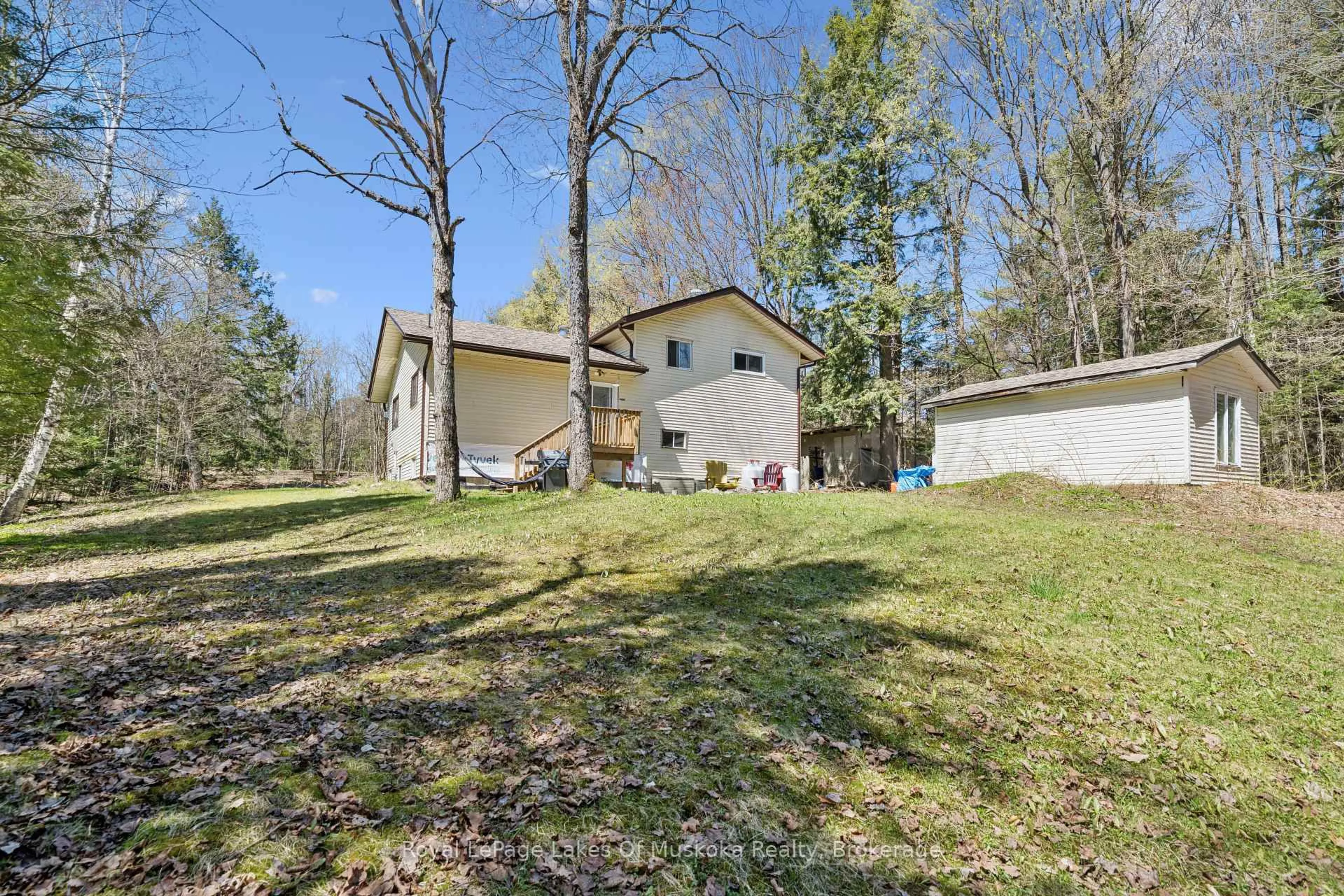 A pic from outside/outdoor area/front of a property/back of a property/a pic from drone, forest/trees view for 1052 Old Falkenburg Rd, Bracebridge Ontario P1L 1X4