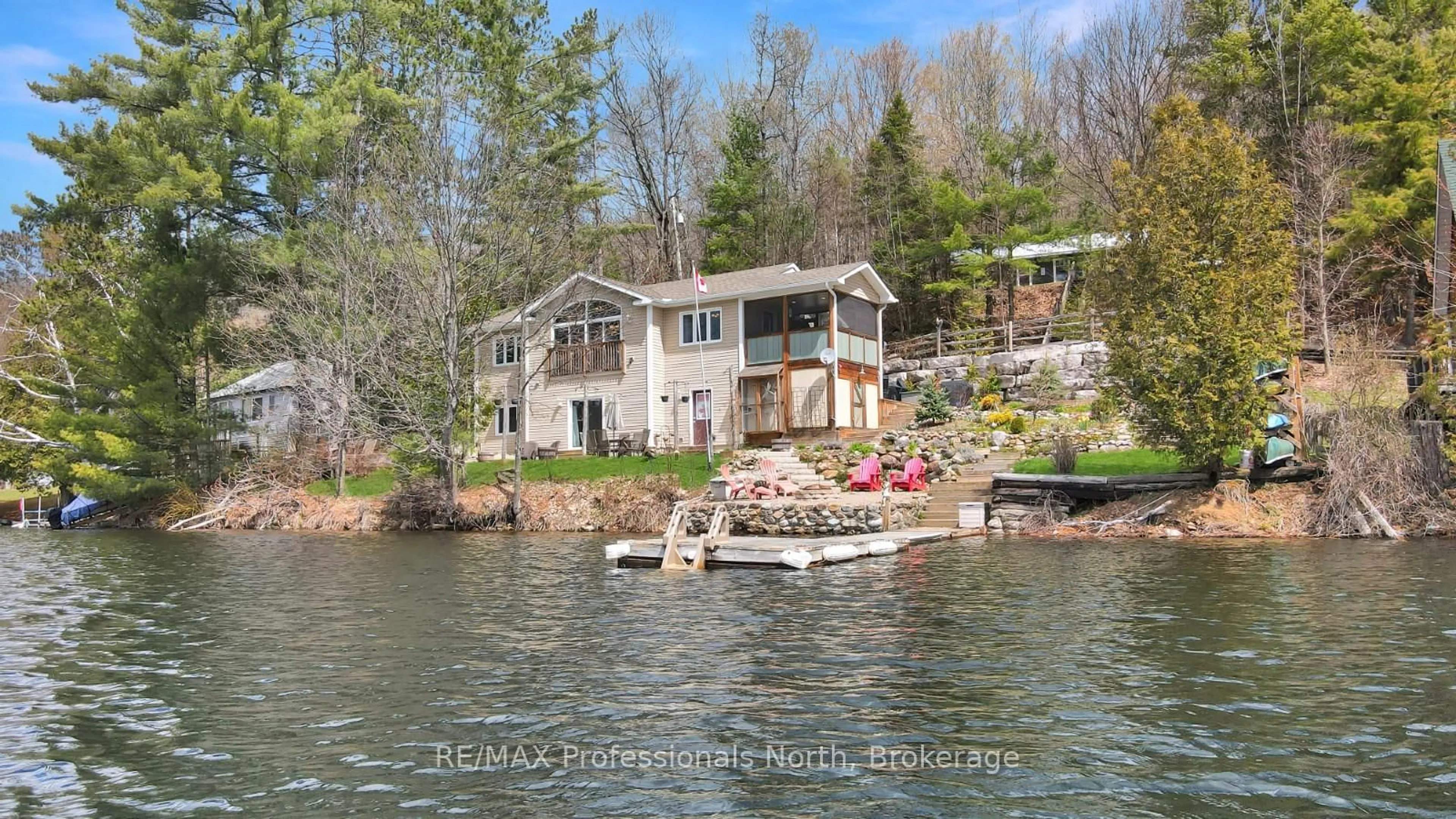 A pic from outside/outdoor area/front of a property/back of a property/a pic from drone, water/lake/river/ocean view for 1325 & 1314 Claude Brown Rd, Minden Hills Ontario K0M 2K0