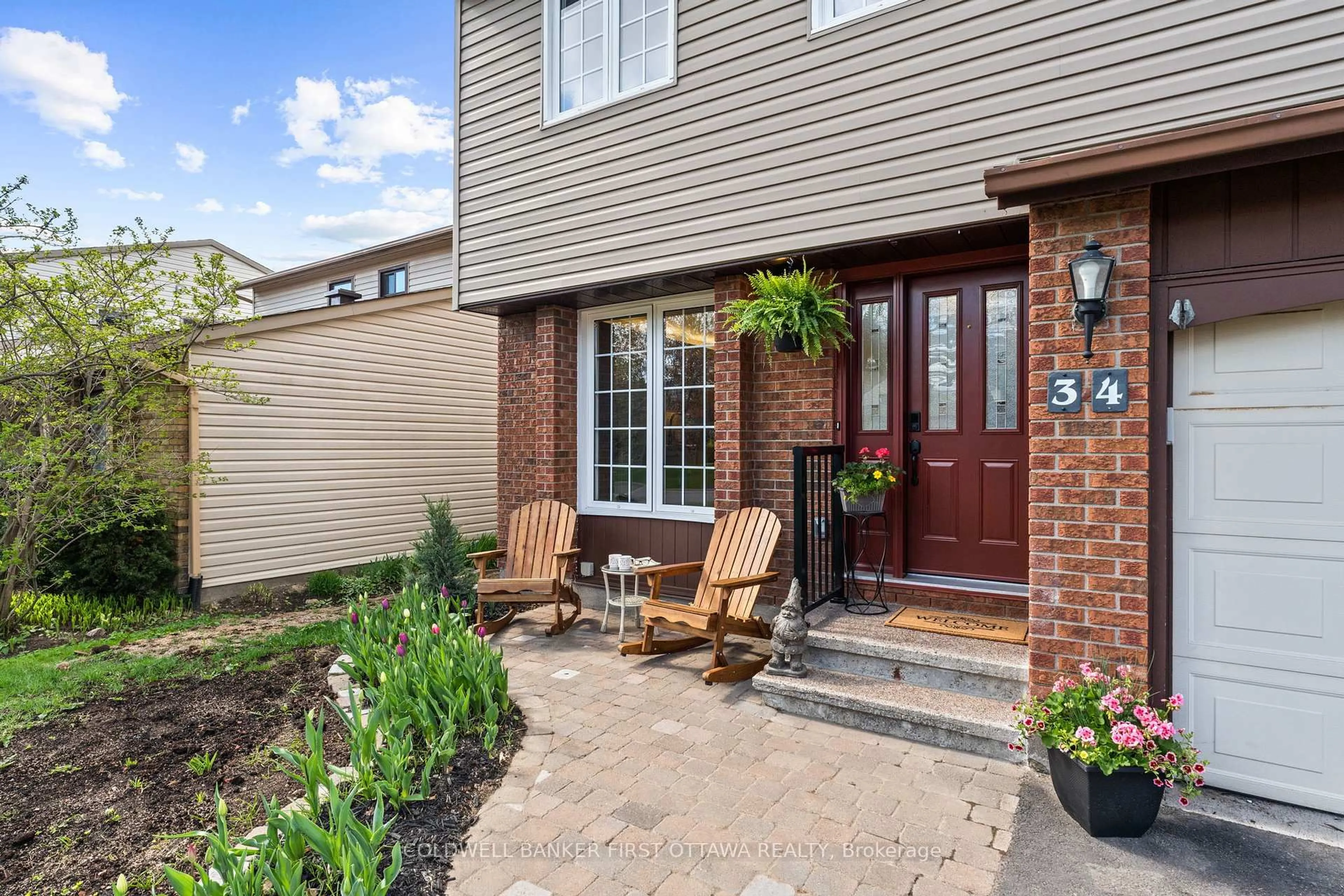 Home with brick exterior material, street for 34 Melville Dr, Ottawa Ontario K2J 2E9
