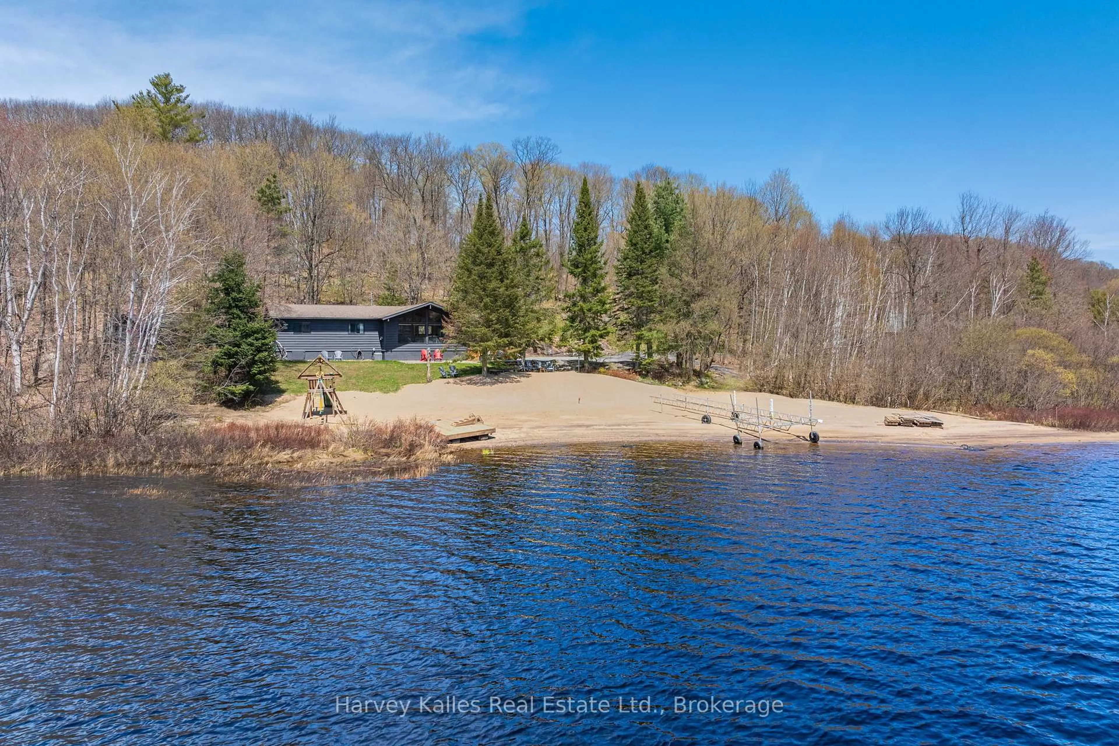 A pic from outside/outdoor area/front of a property/back of a property/a pic from drone, water/lake/river/ocean view for 257 North Deer Lake Rd, Huntsville Ontario P0B 1L0