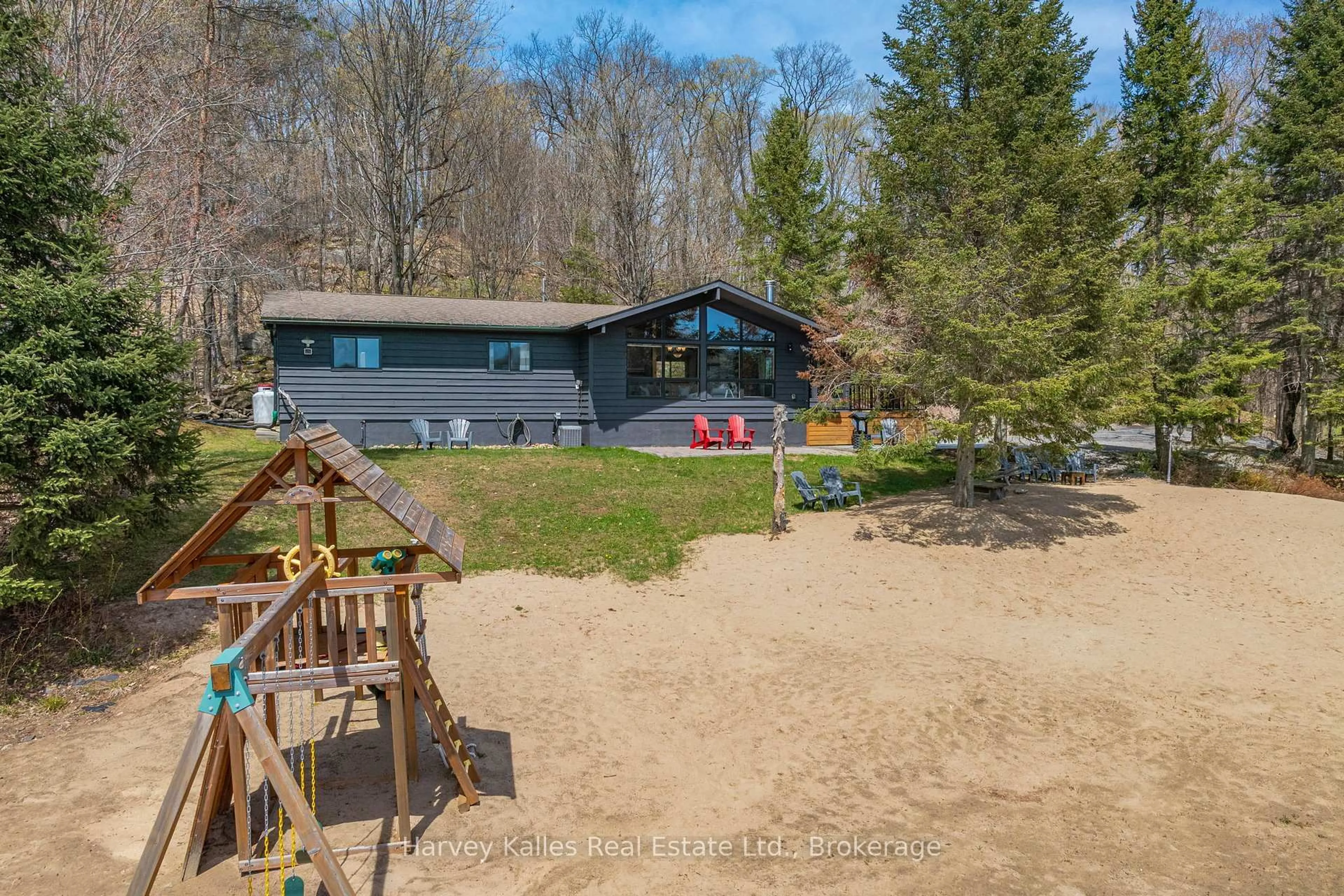 A pic from outside/outdoor area/front of a property/back of a property/a pic from drone, water/lake/river/ocean view for 257 North Deer Lake Rd, Huntsville Ontario P0B 1L0