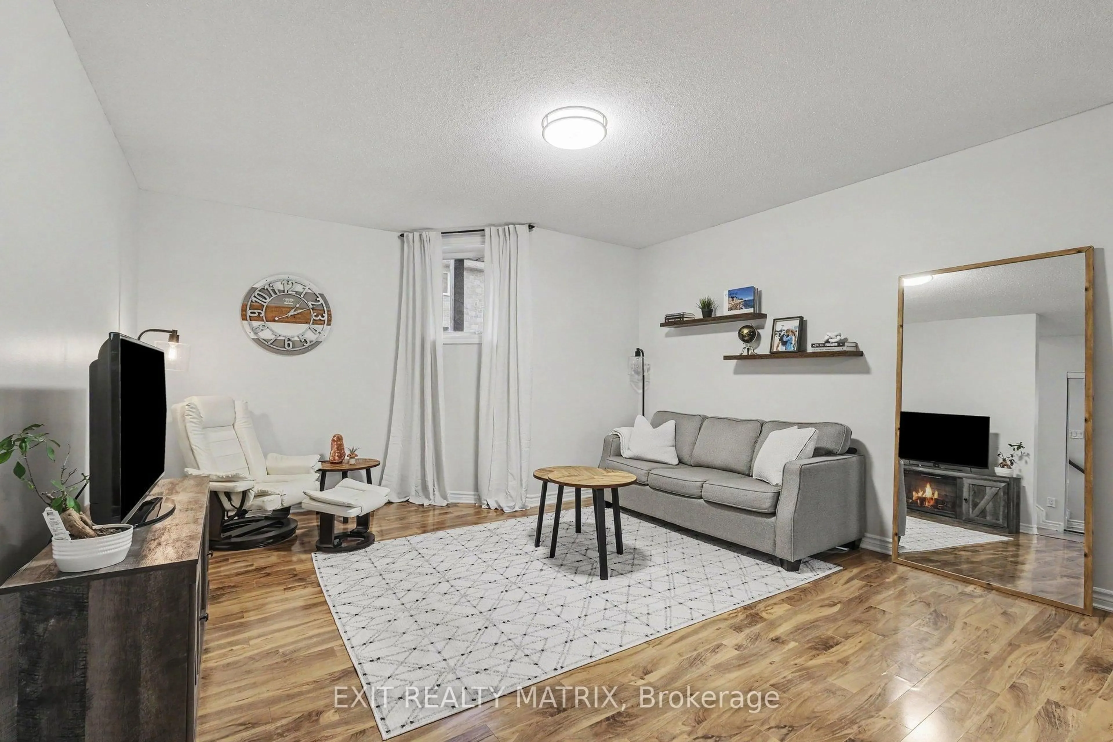 Living room with furniture, wood/laminate floor for 39 MAIN St #8, The Nation Ontario K0A 2M0