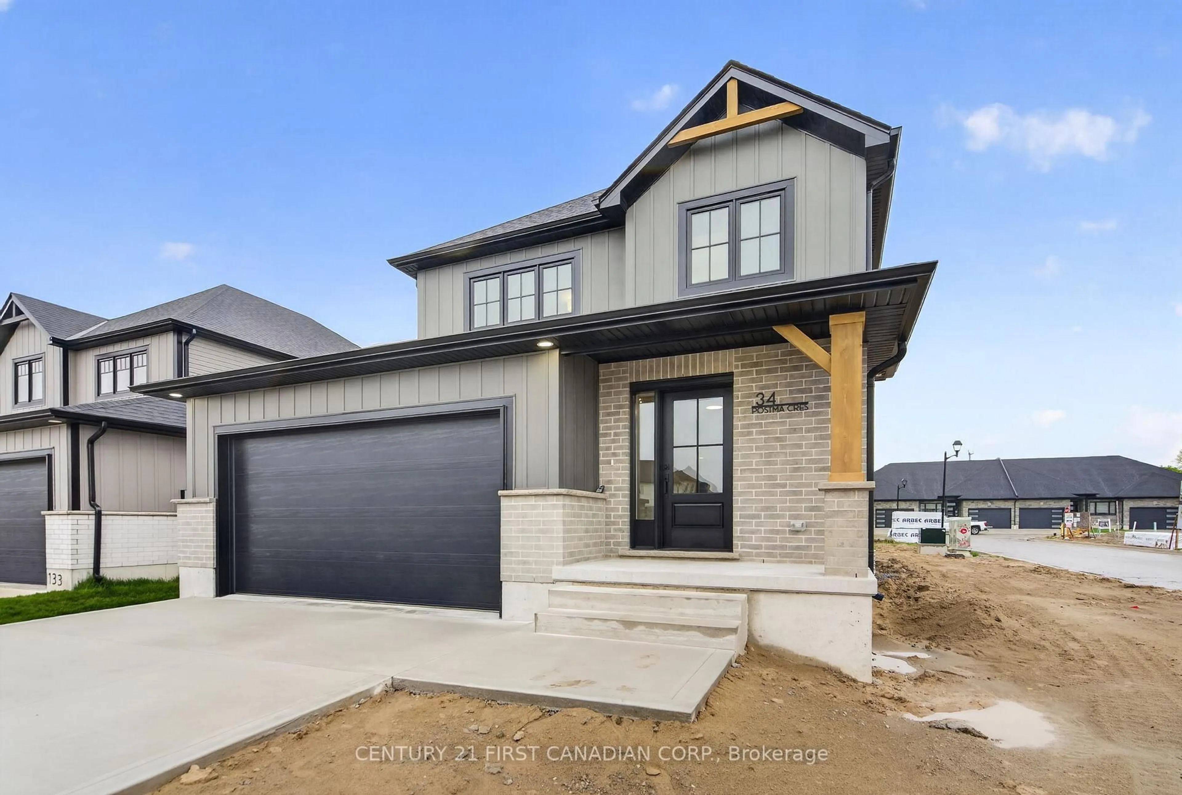 Home with brick exterior material, street for 34 Postma Cres, North Middlesex Ontario N0M 1A0