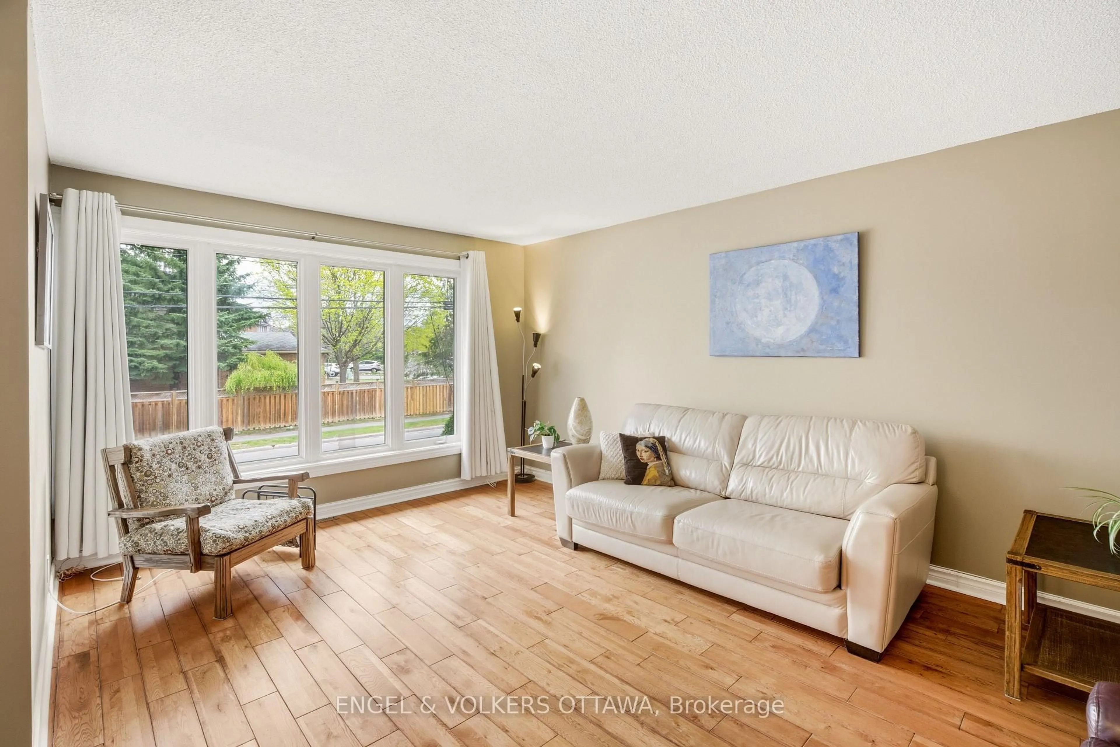 Living room with furniture, wood/laminate floor for 668 De L'eglise St, Ottawa Ontario K1K 3K2