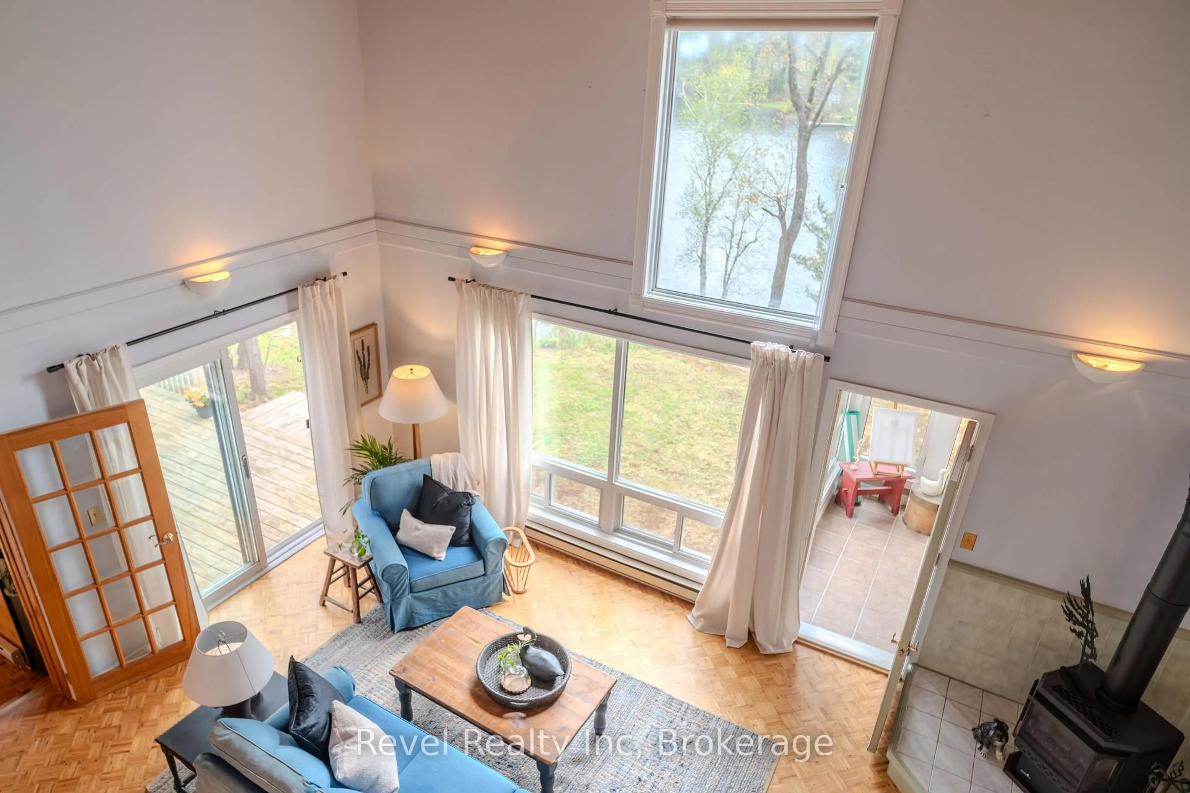 Living room with furniture, wood/laminate floor for 14 Swallow Rd, McDougall Ontario P2A 2W7