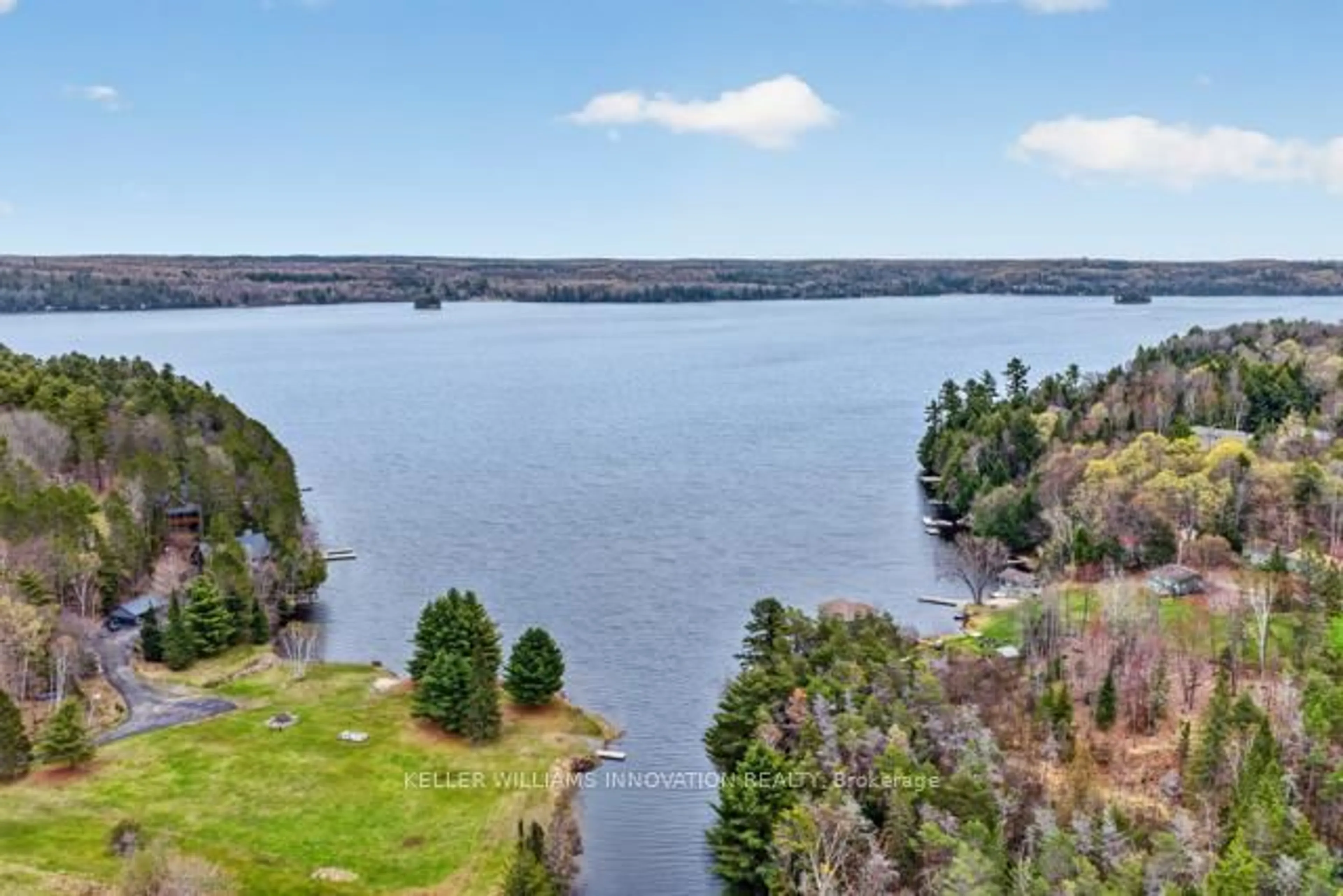 A pic from outside/outdoor area/front of a property/back of a property/a pic from drone, water/lake/river/ocean view for 469 Rowanwood Rd, Huntsville Ontario P0B 1M0