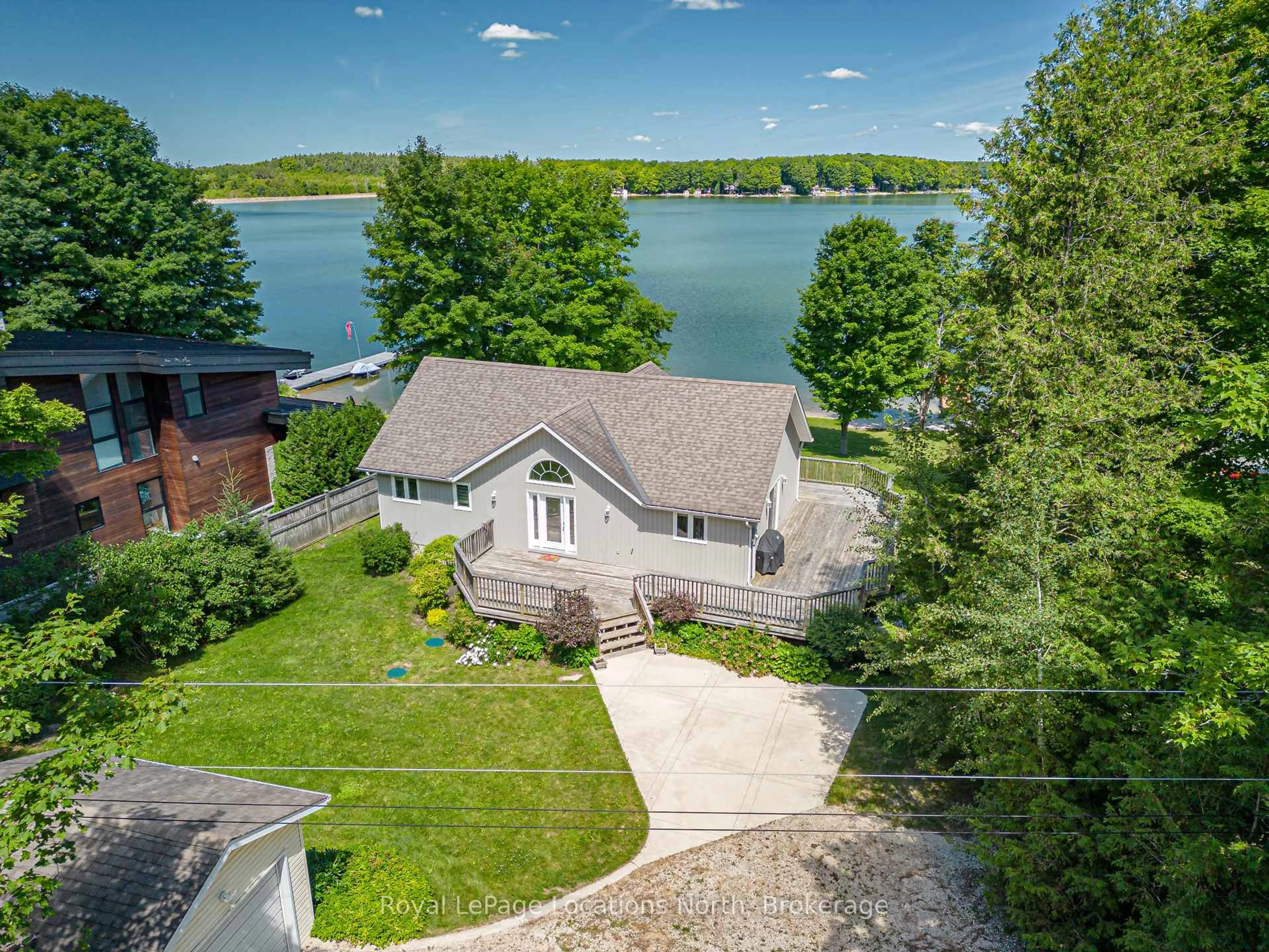 A pic from outside/outdoor area/front of a property/back of a property/a pic from drone, water/lake/river/ocean view for 115 South Shores Rd, Grey Highlands Ontario N0C 1E0