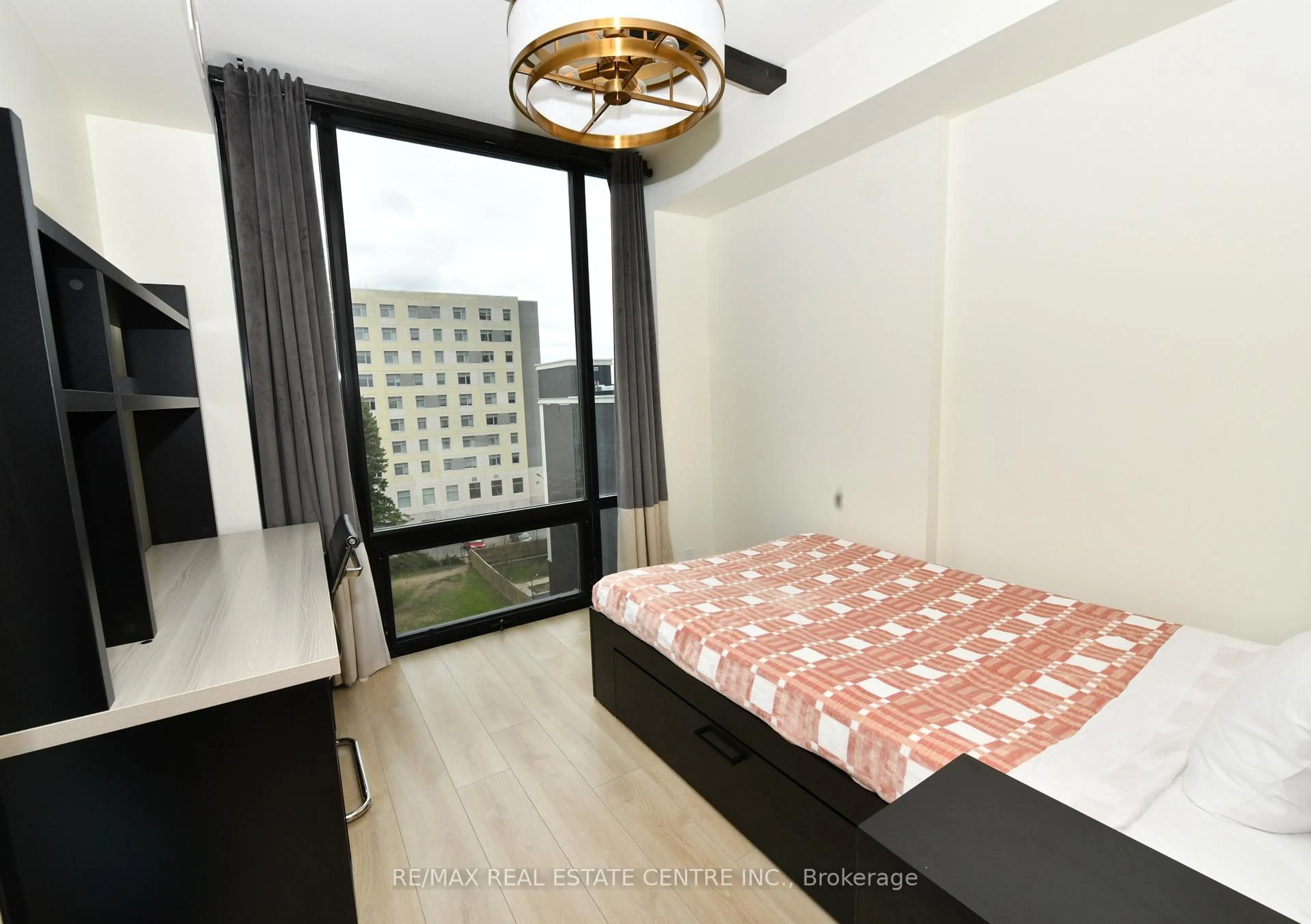 Bedroom with bed, wood/laminate floor for 145 Columbia St #736, Waterloo Ontario N2L 3L2