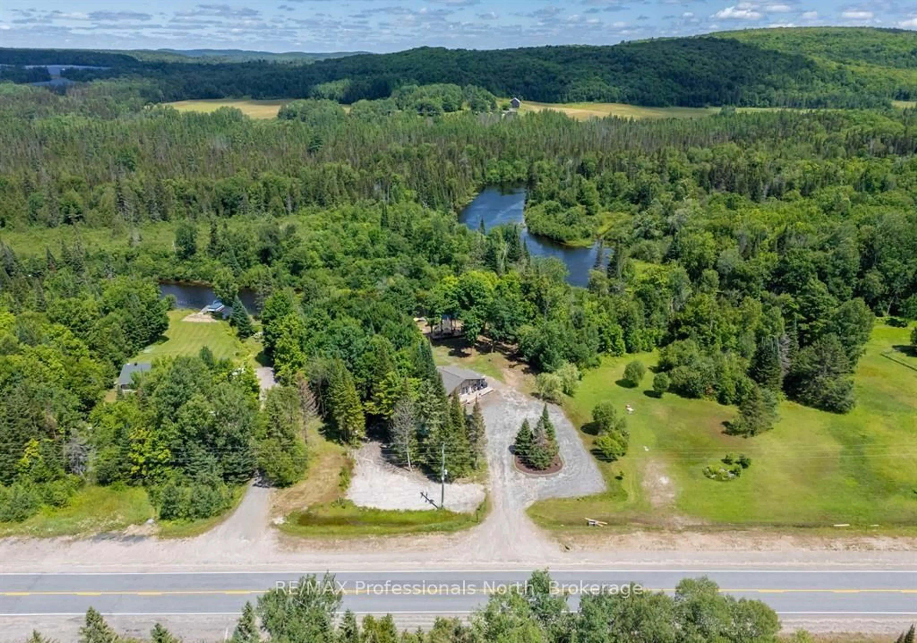 A pic from outside/outdoor area/front of a property/back of a property/a pic from drone, water/lake/river/ocean view for 899 KATRINE Rd, Burk's Falls Ontario P0A 1C0
