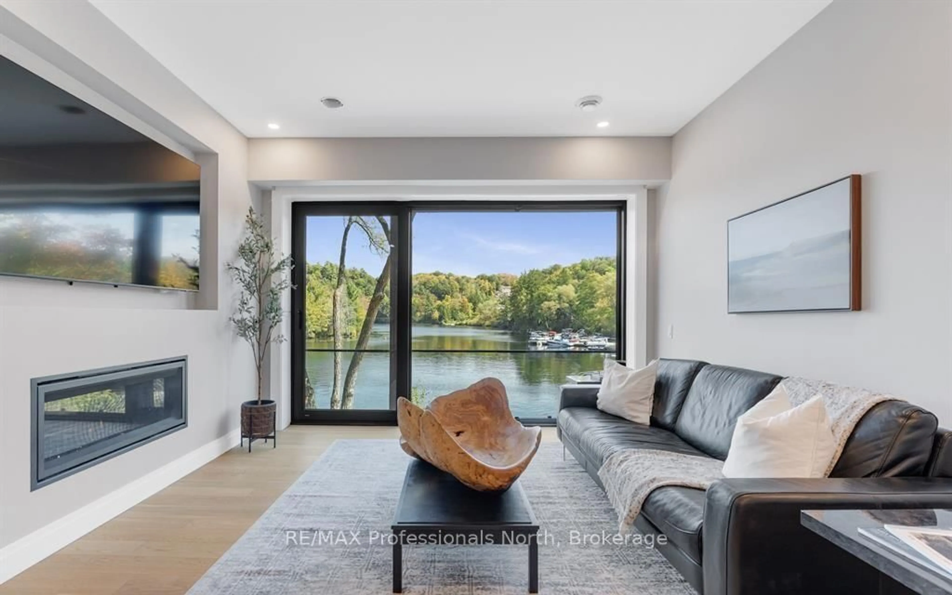 Living room with furniture, unknown for 32 Brunel Rd #201, Huntsville Ontario P1H 1P5