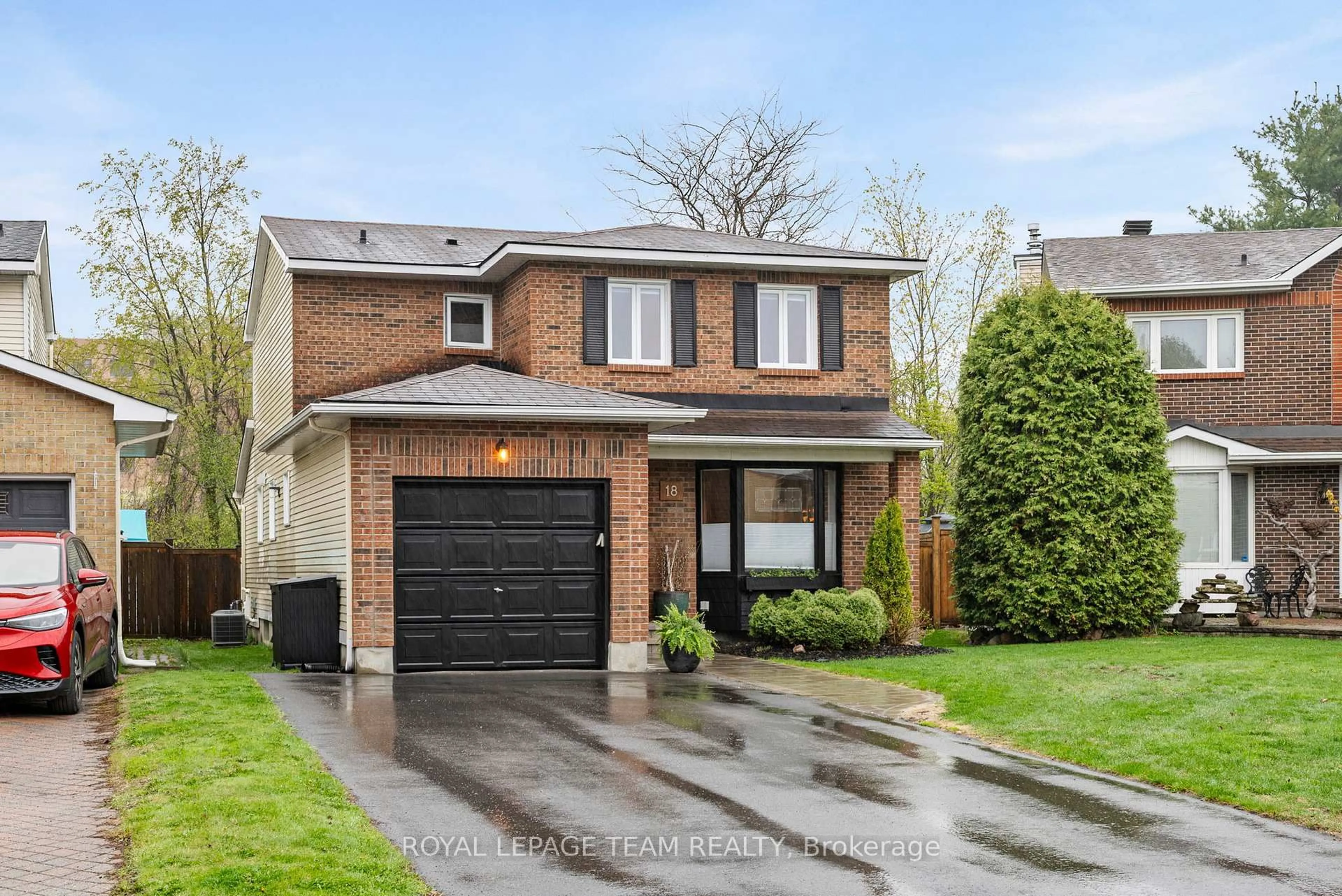 Home with brick exterior material, street for 18 Valley Ridge St, Ottawa Ontario K2E 7V9