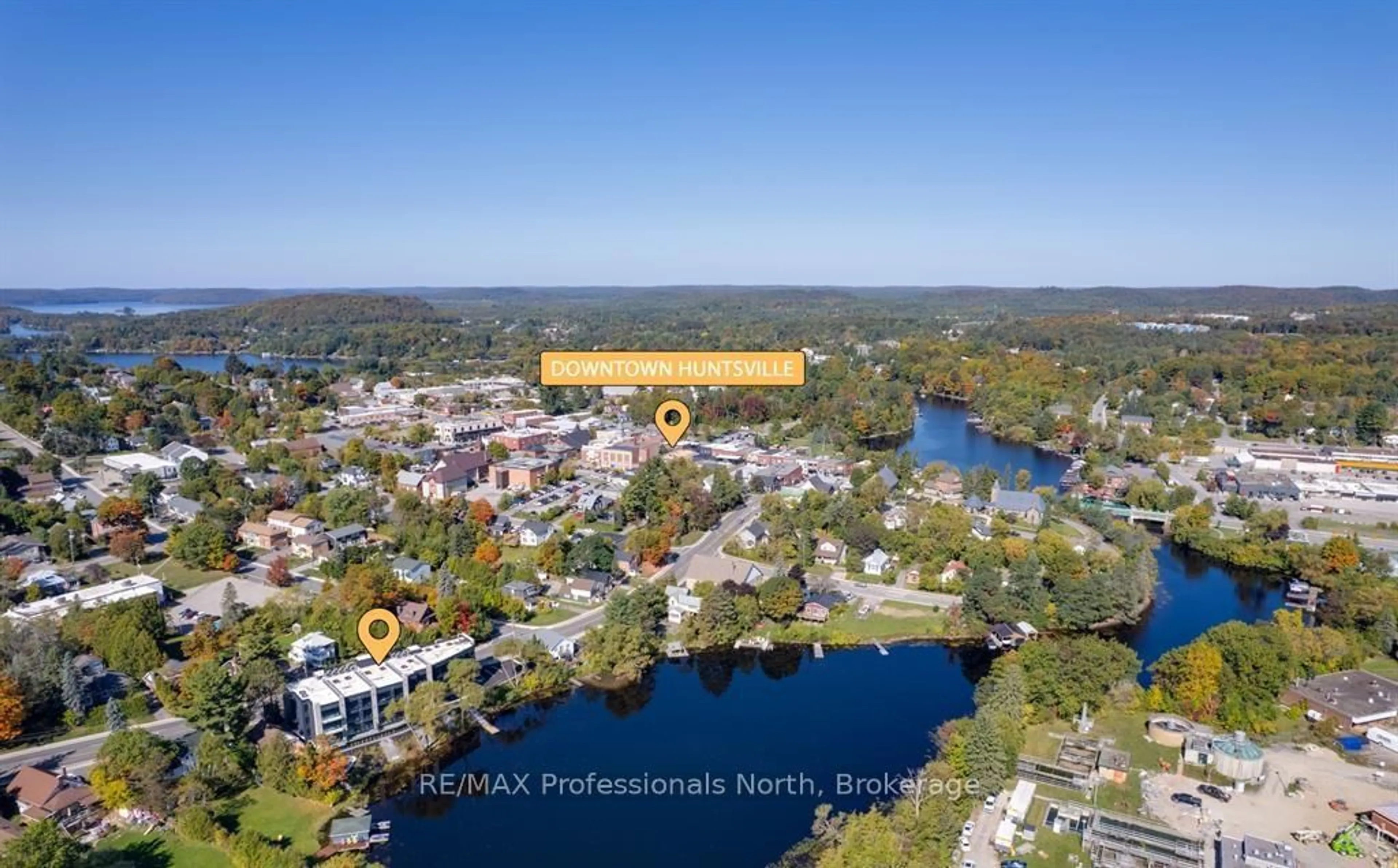 A pic from outside/outdoor area/front of a property/back of a property/a pic from drone, water/lake/river/ocean view for 32 Brunel Rd #102, Huntsville Ontario P1H 1P5