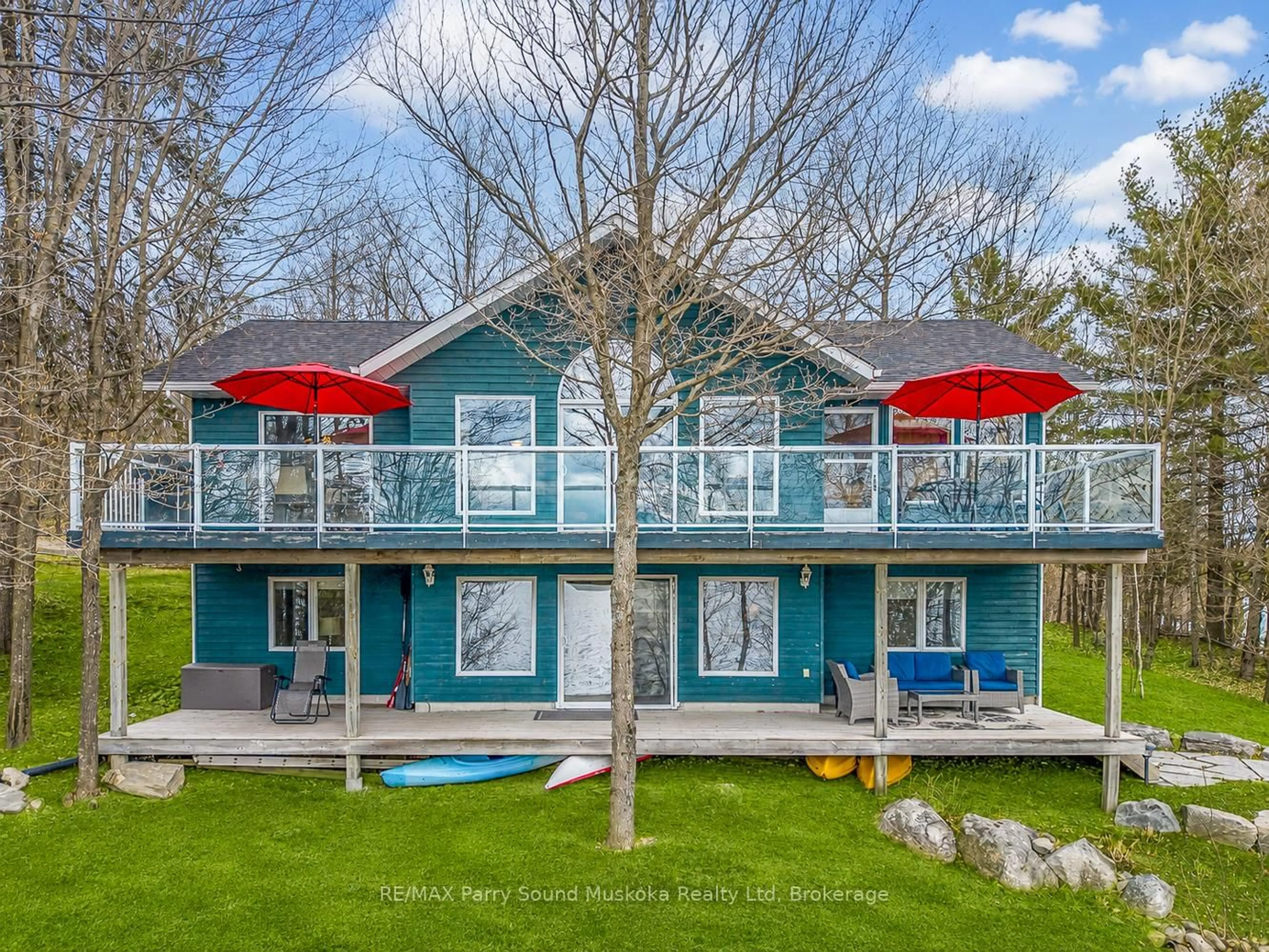 A pic from outside/outdoor area/front of a property/back of a property/a pic from drone, water/lake/river/ocean view for 54 Dauncey Rd, Magnetawan Ontario P0A 1P0