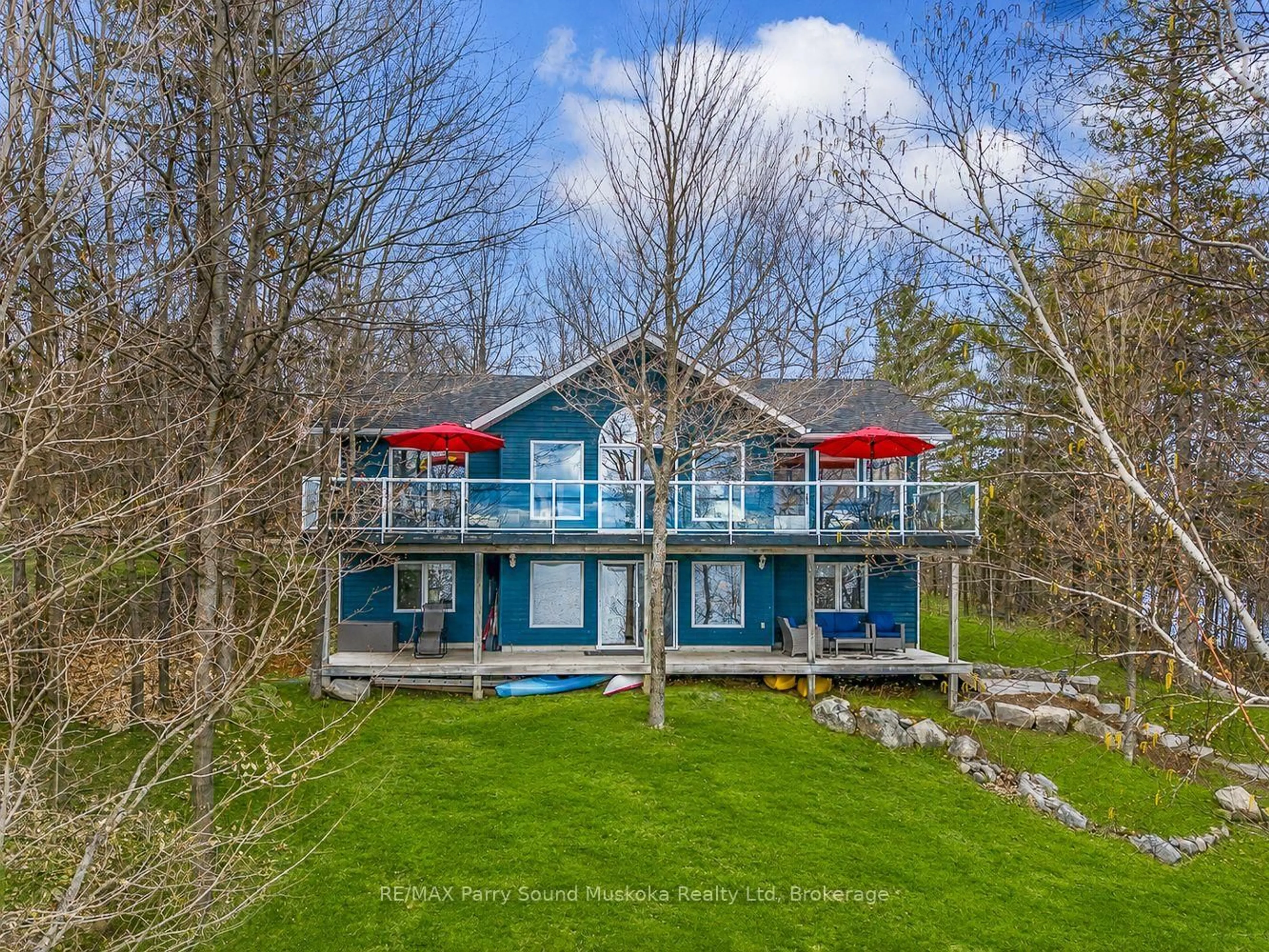 A pic from outside/outdoor area/front of a property/back of a property/a pic from drone, water/lake/river/ocean view for 54 Dauncey Rd, Magnetawan Ontario P0A 1P0
