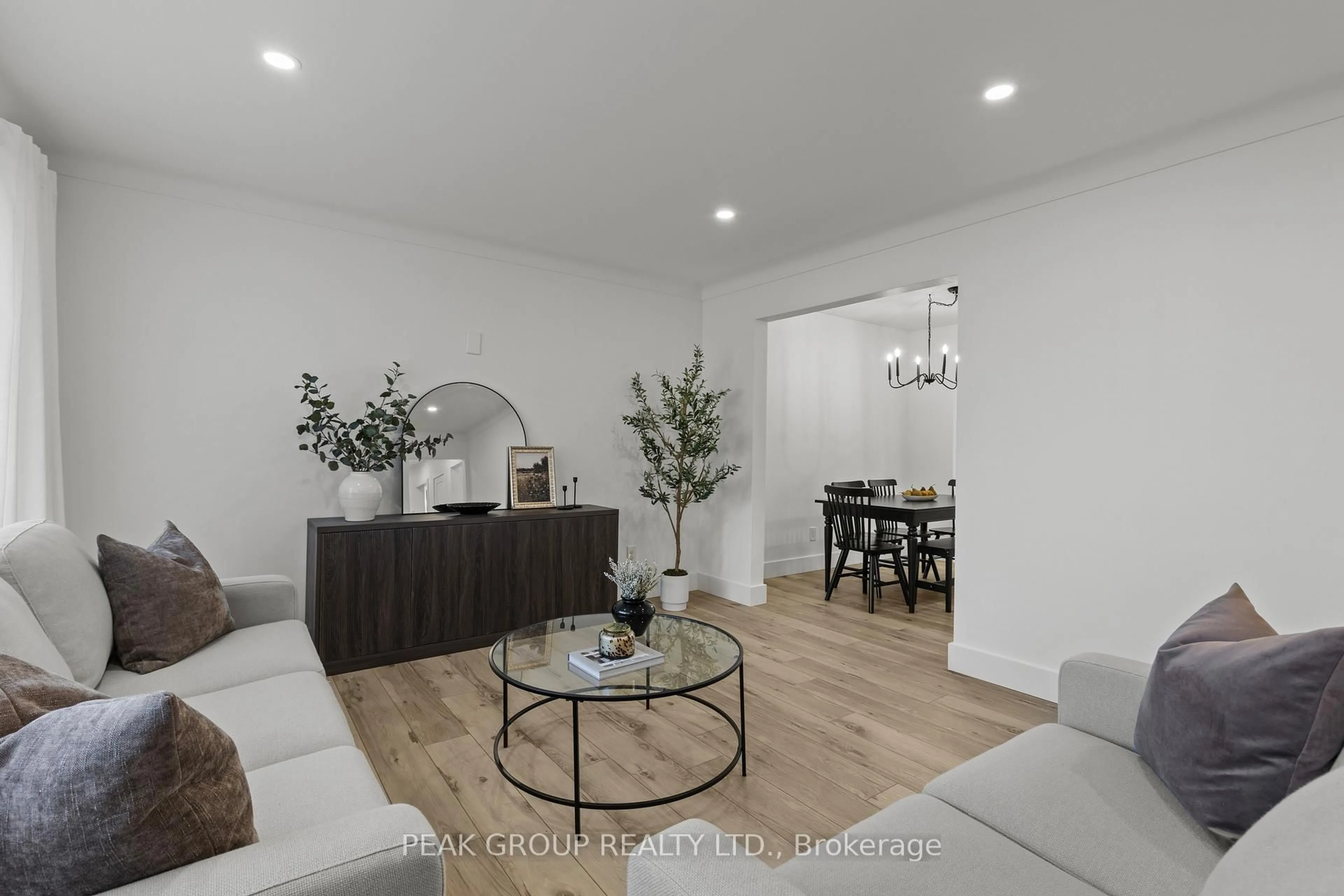 Living room with furniture, wood/laminate floor for 3799 Windermere Rd, Niagara Falls Ontario L2J 2Y4