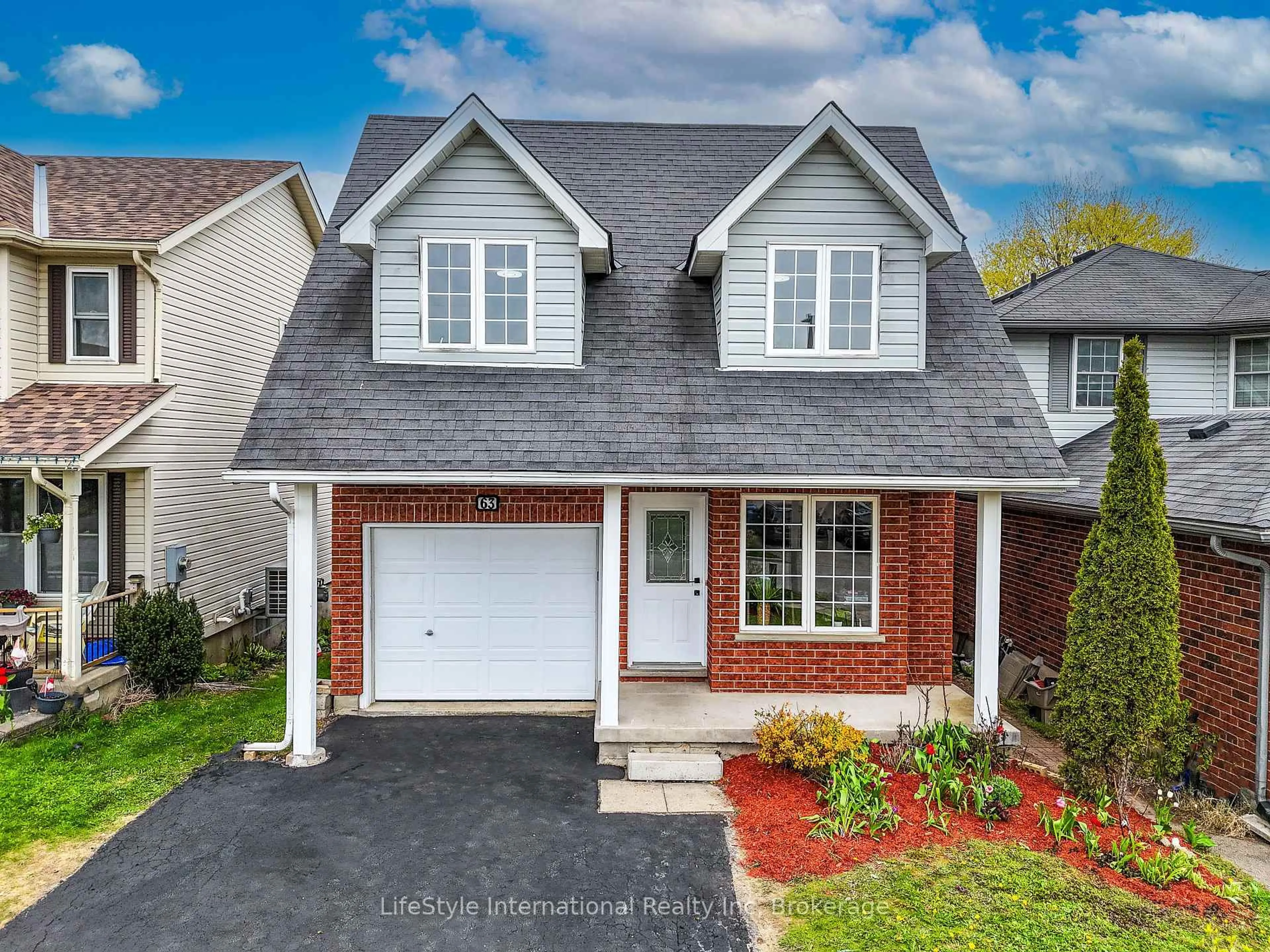 Home with brick exterior material, street for 63 Hagan Ave, Guelph Ontario N1E 7B7