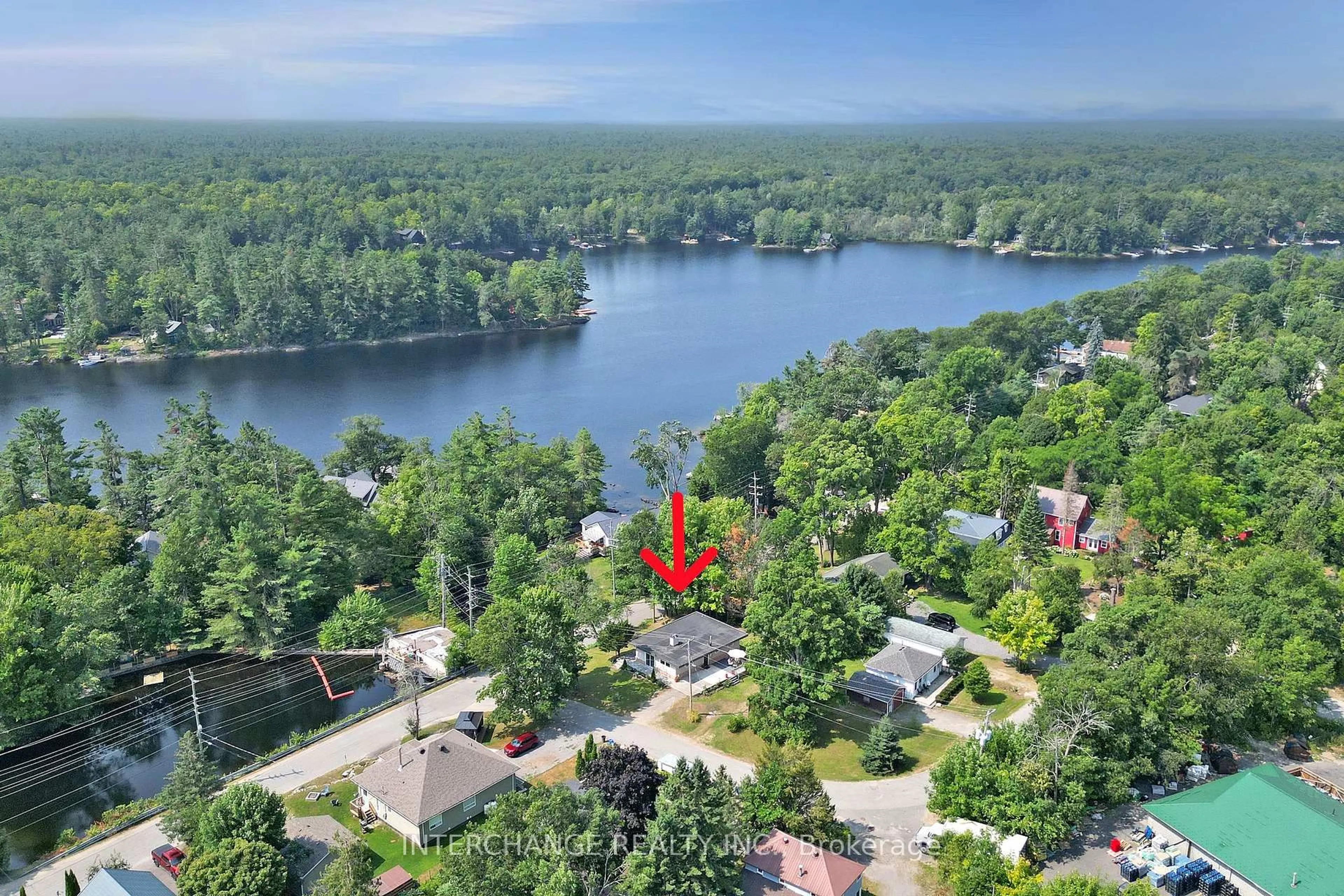 A pic from outside/outdoor area/front of a property/back of a property/a pic from drone, water/lake/river/ocean view for 1018 Mill St, Muskoka Lakes Ontario P0C 1A0