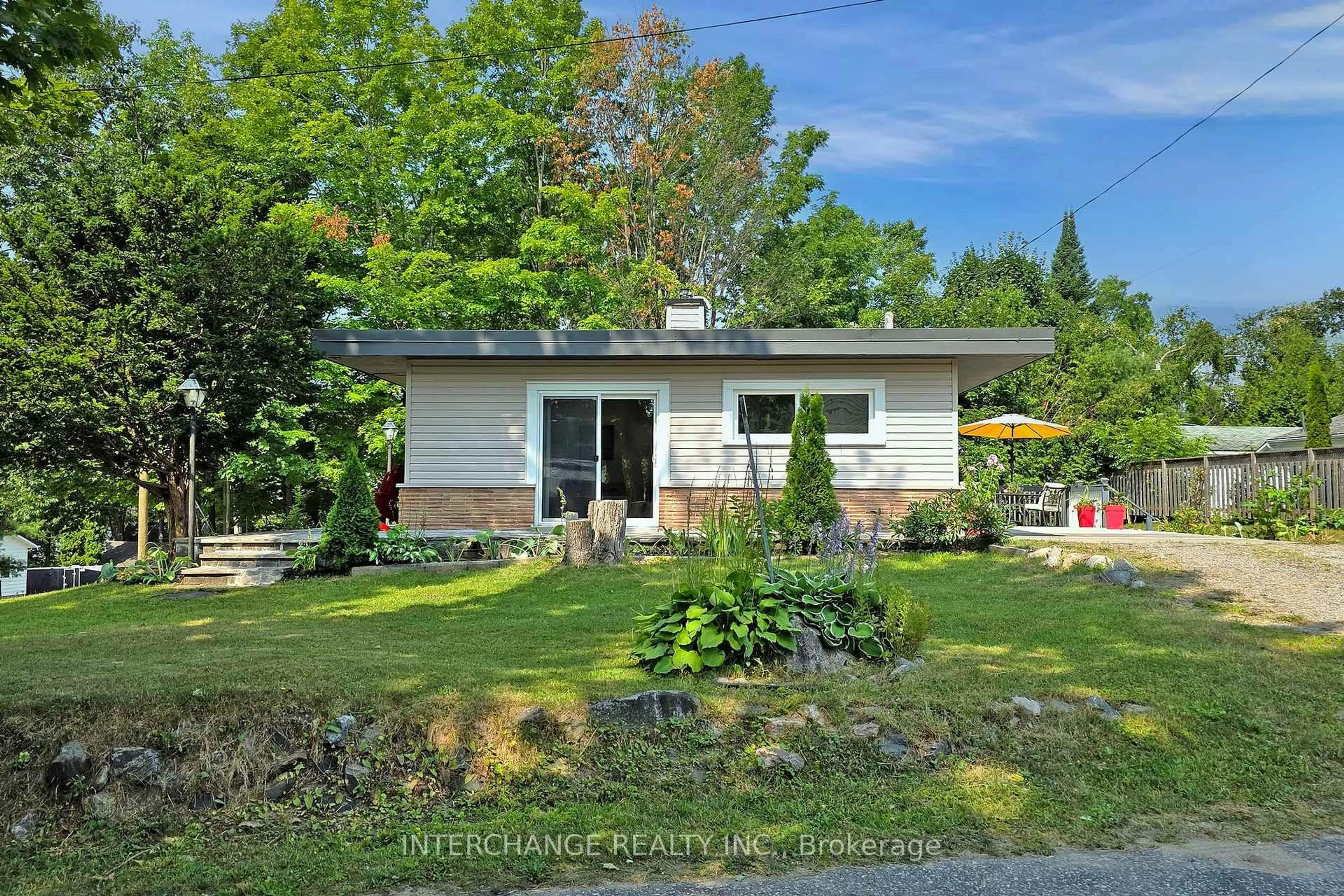 A pic from outside/outdoor area/front of a property/back of a property/a pic from drone, street for 1018 Mill St, Muskoka Lakes Ontario P0C 1A0