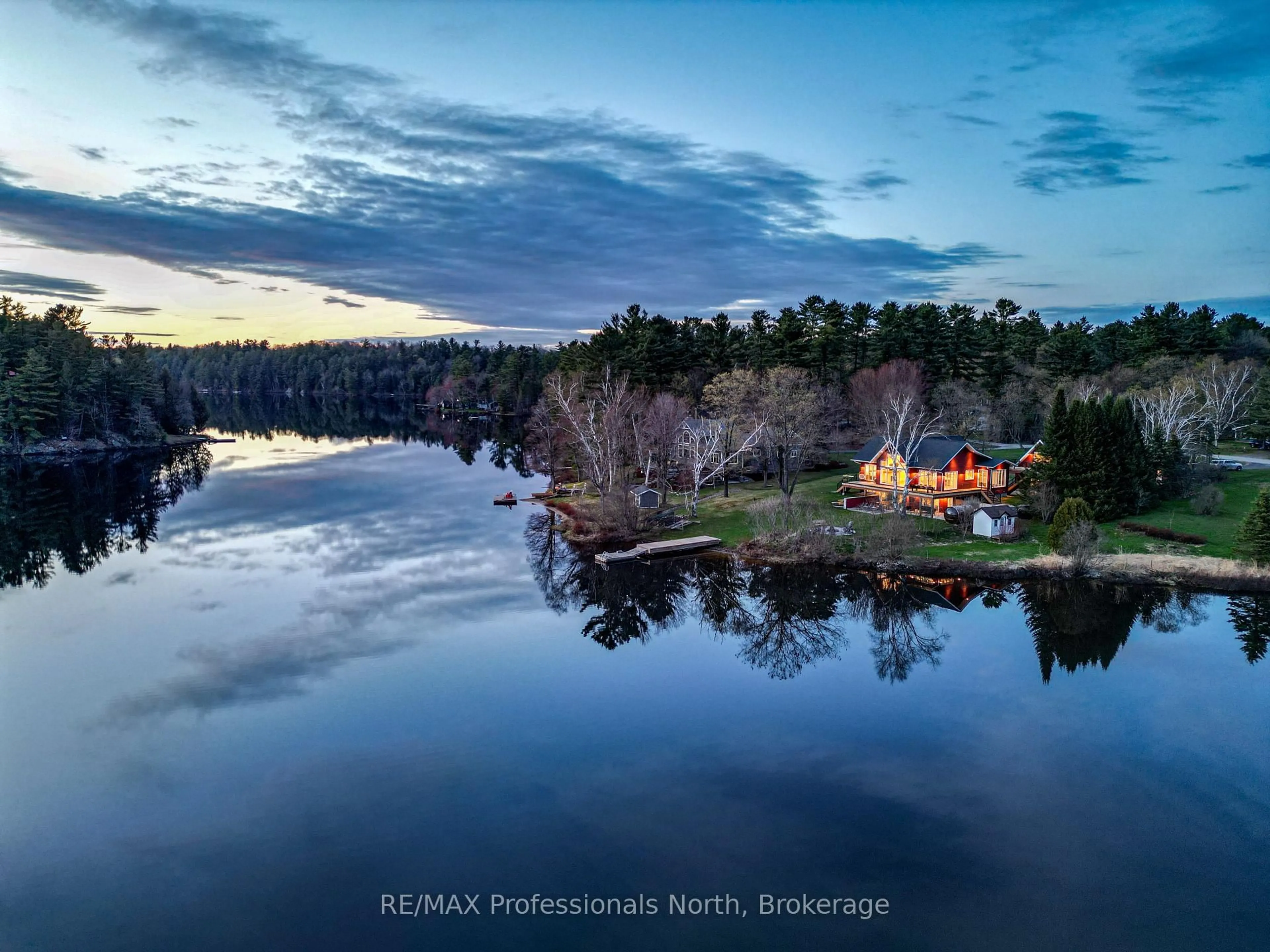 A pic from outside/outdoor area/front of a property/back of a property/a pic from drone, water/lake/river/ocean view for 36 Beach Rd, Huntsville Ontario P0B 1M0