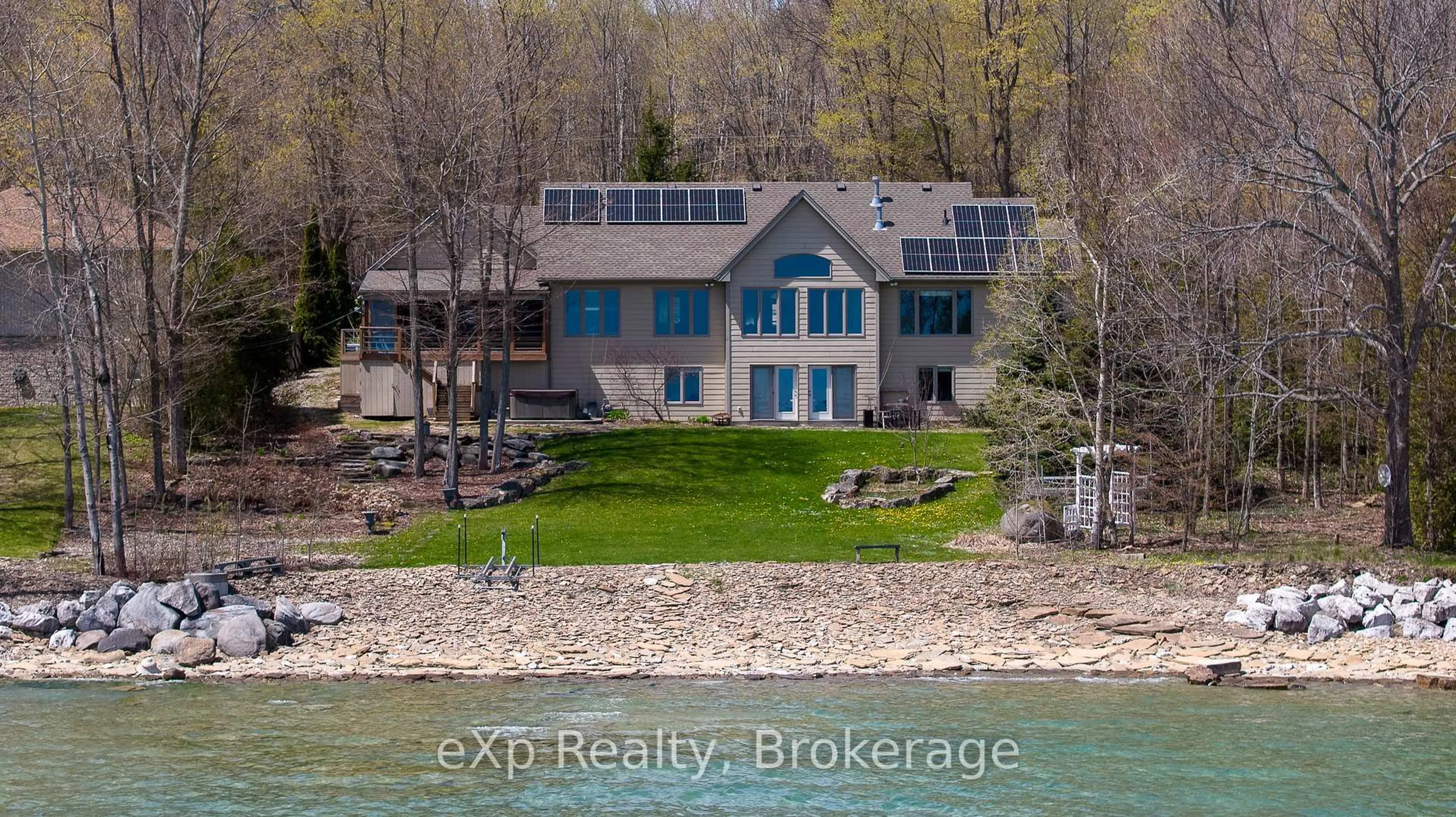 A pic from outside/outdoor area/front of a property/back of a property/a pic from drone, water/lake/river/ocean view for 504853 Grey Road 1, Georgian Bluffs Ontario N0H 1S0