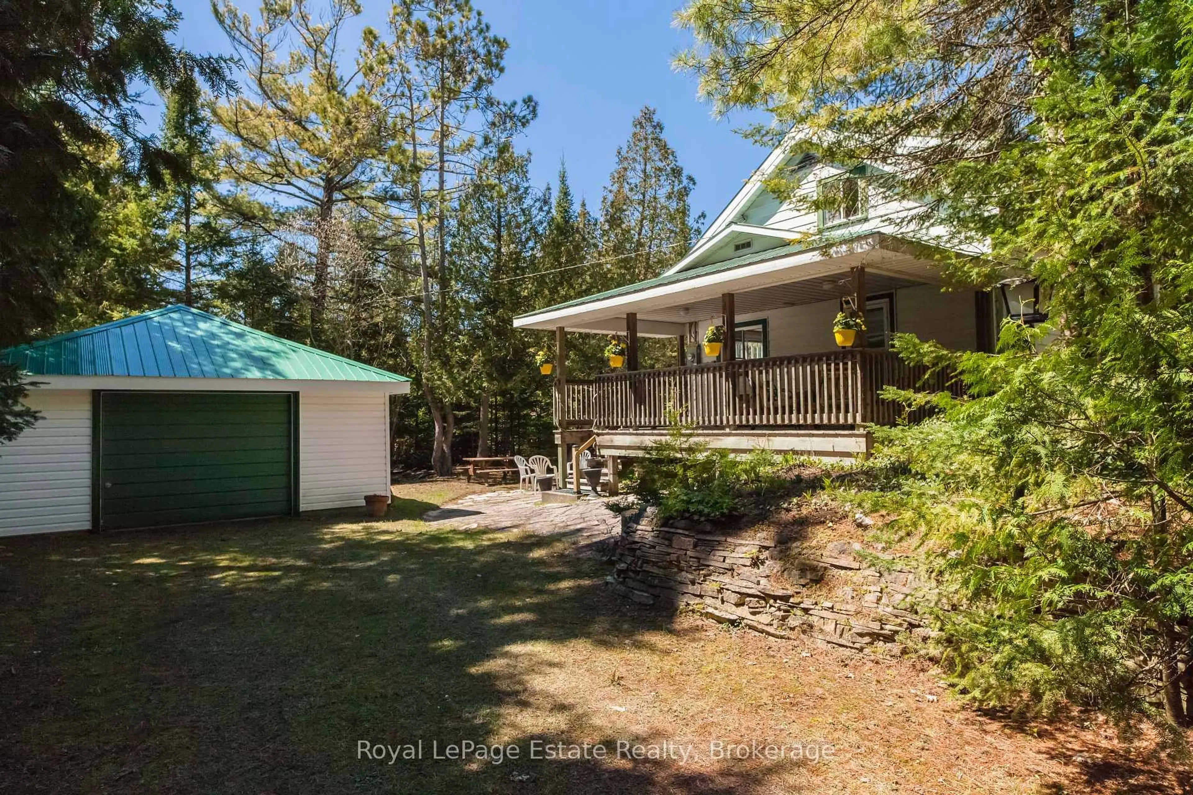 A pic from outside/outdoor area/front of a property/back of a property/a pic from drone, forest/trees view for 138 Third Ave, South Bruce Peninsula Ontario N0H 2G0