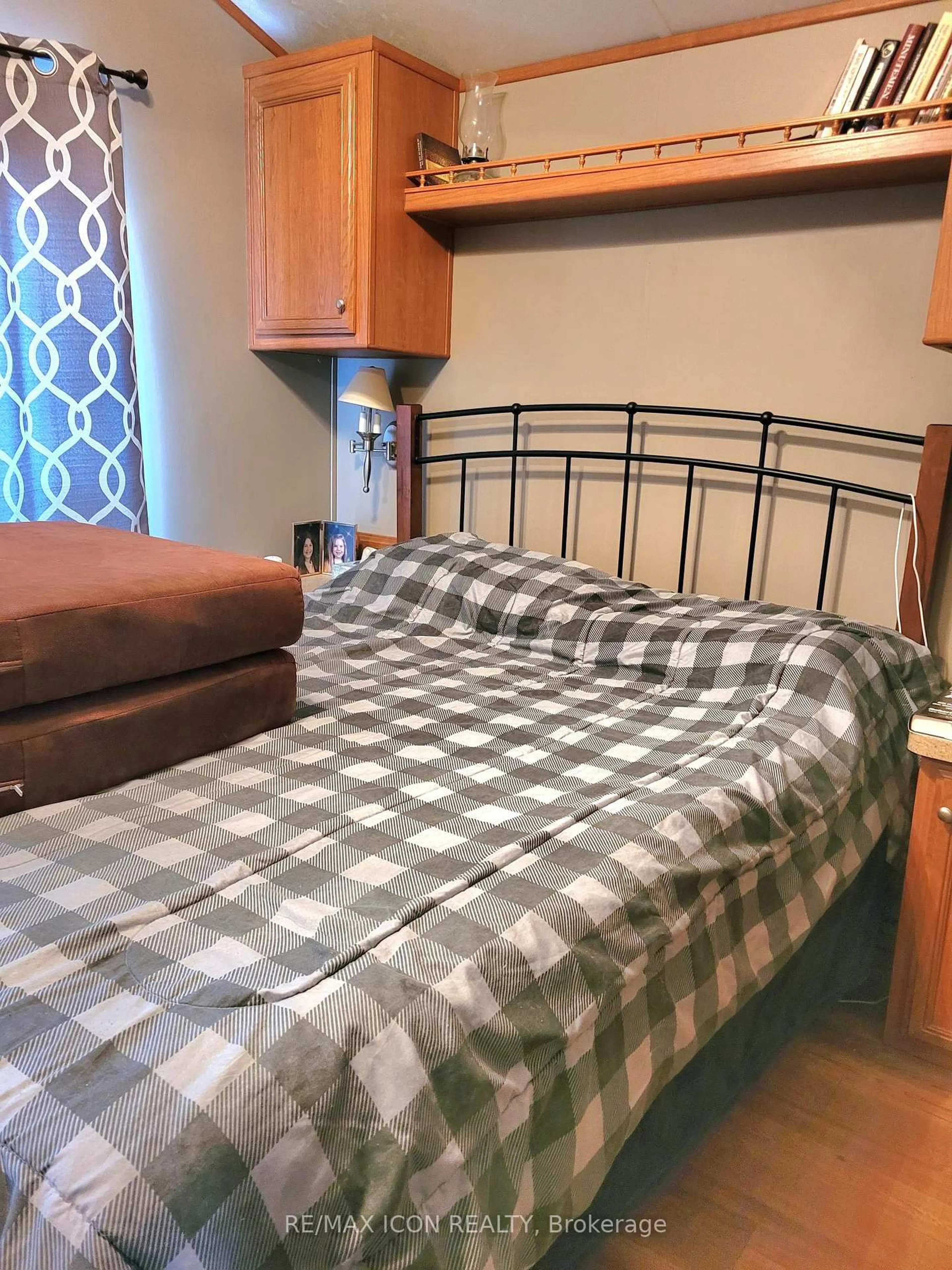 Bedroom with bed, wood/laminate floor for 77719 Bluewater Highway #41 Portside Dr, Bluewater Ontario N0M 1G0