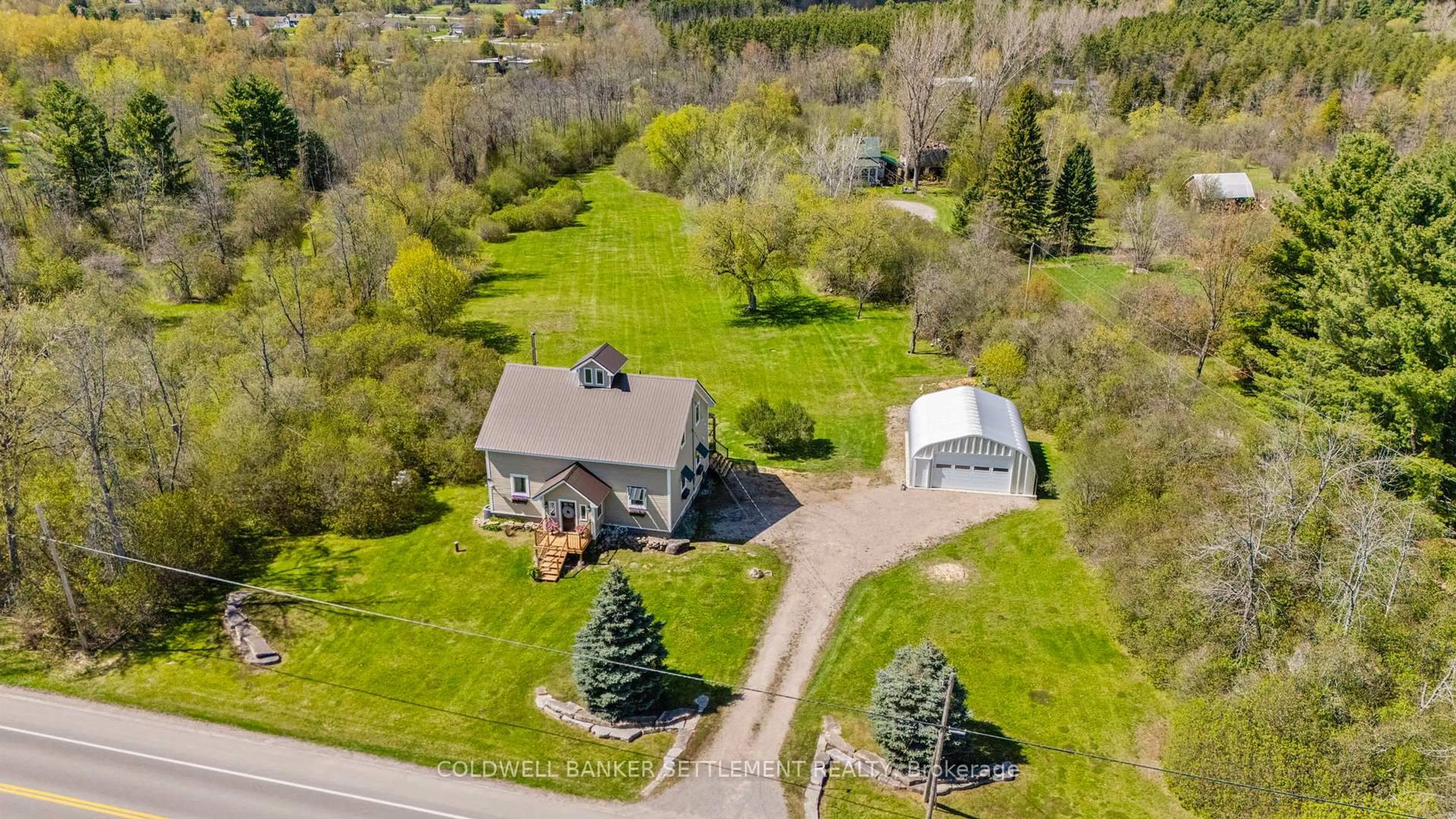 A pic from outside/outdoor area/front of a property/back of a property/a pic from drone, street for 210 Port Elmsley Rd, Perth Ontario K7H 3C7