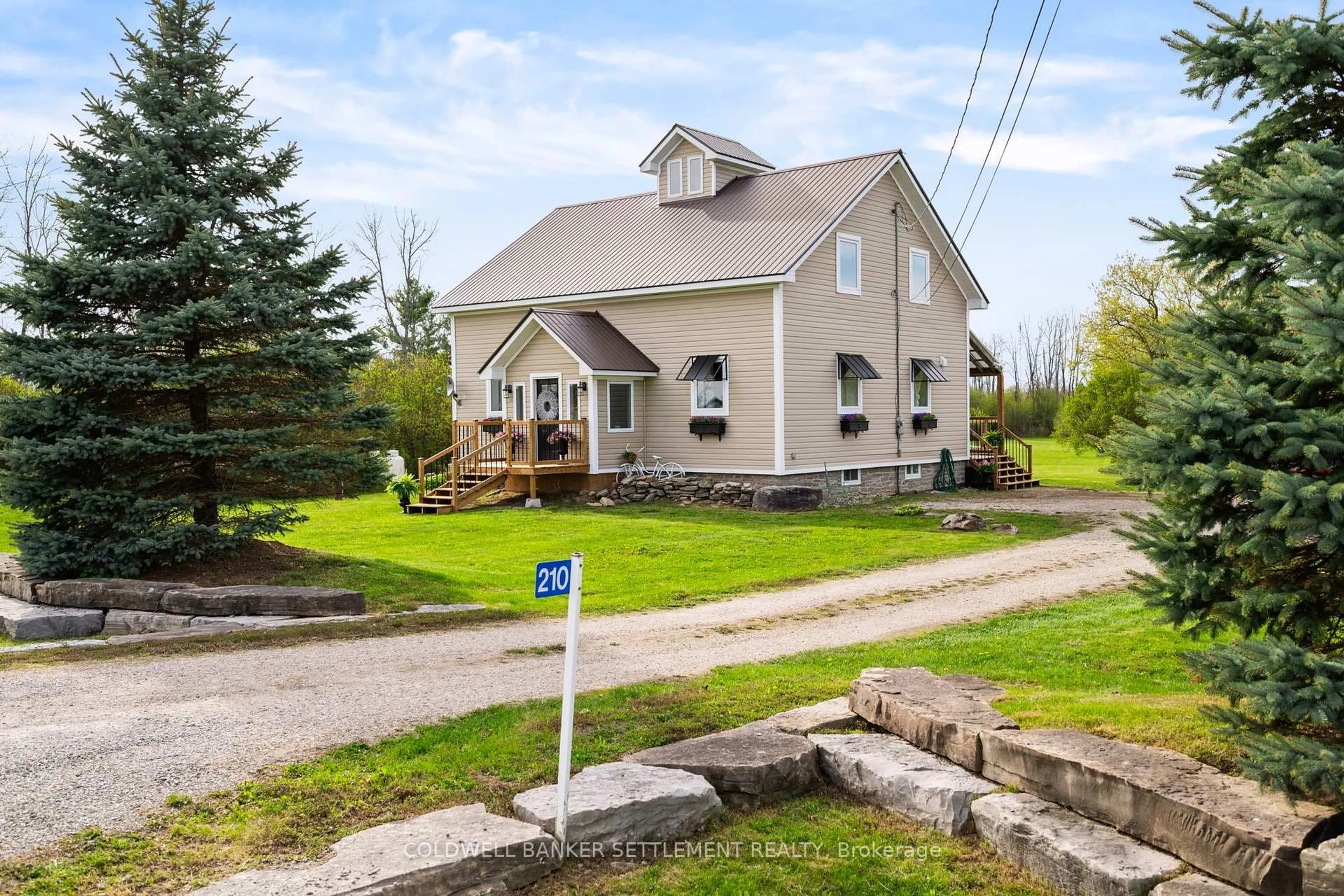 A pic from outside/outdoor area/front of a property/back of a property/a pic from drone, street for 210 Port Elmsley Rd, Perth Ontario K7H 3C7