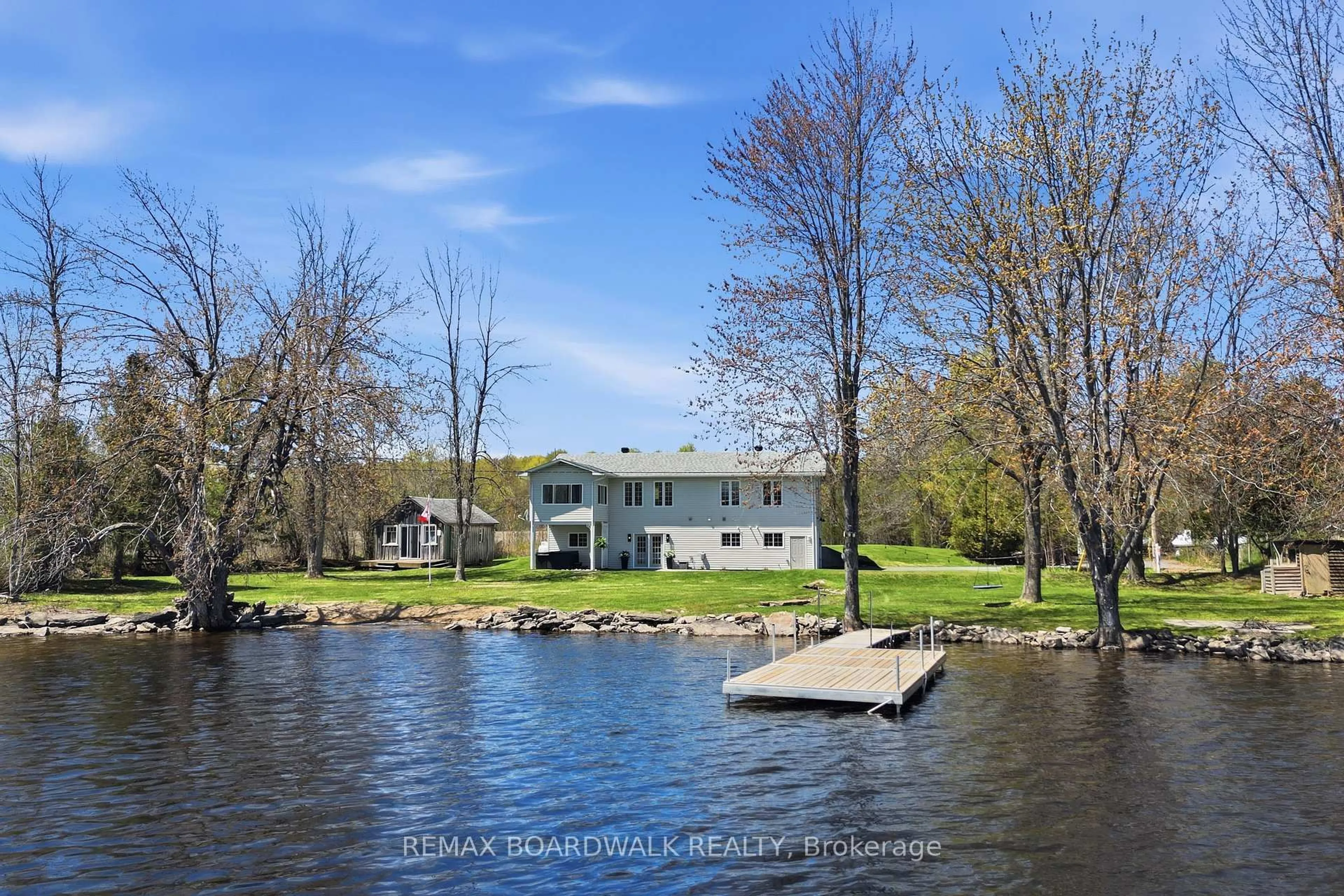 A pic from outside/outdoor area/front of a property/back of a property/a pic from drone, water/lake/river/ocean view for 100 Mcculloughs Landing, Perth Ontario K7H 3C8