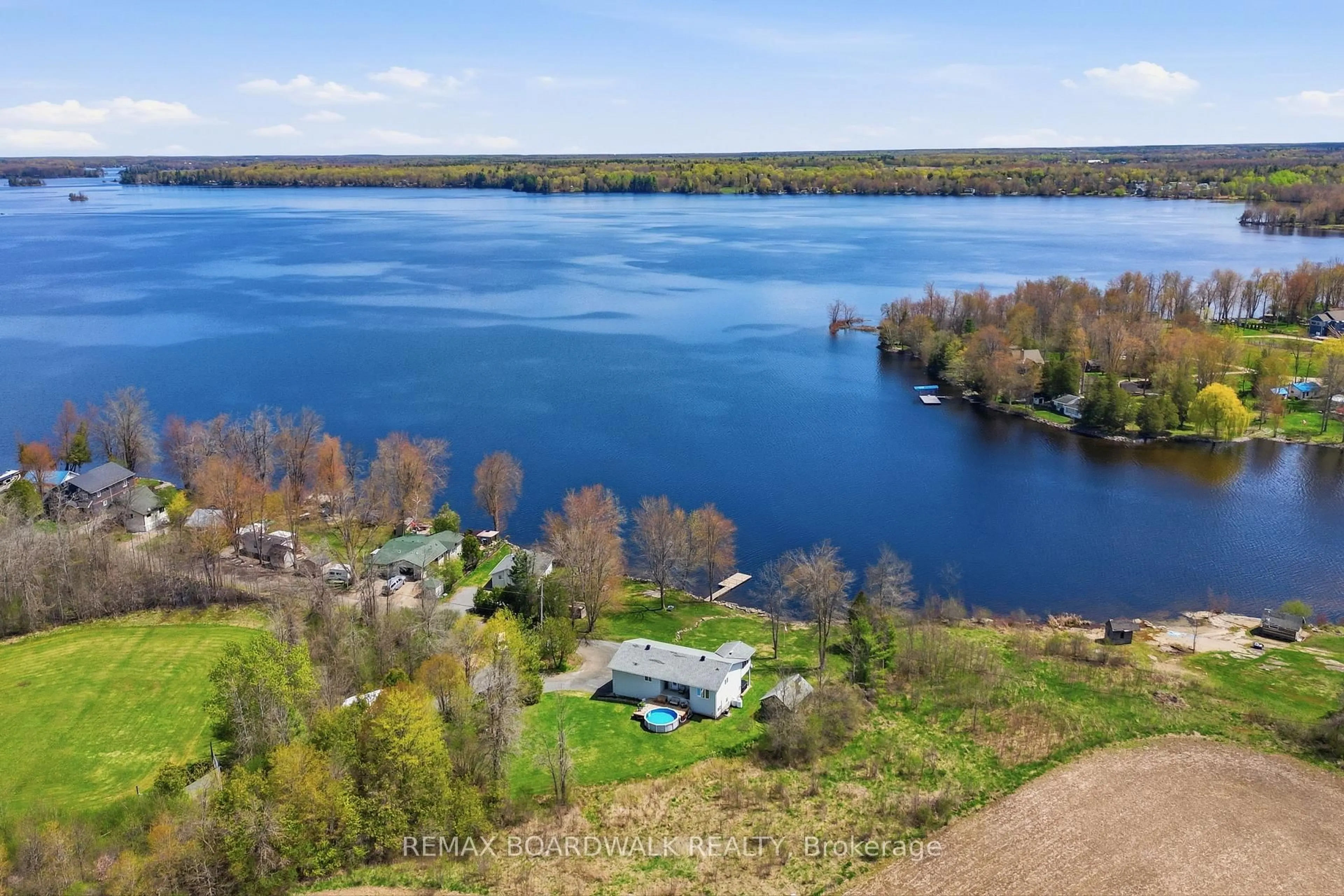 A pic from outside/outdoor area/front of a property/back of a property/a pic from drone, water/lake/river/ocean view for 100 Mcculloughs Landing, Perth Ontario K7H 3C8