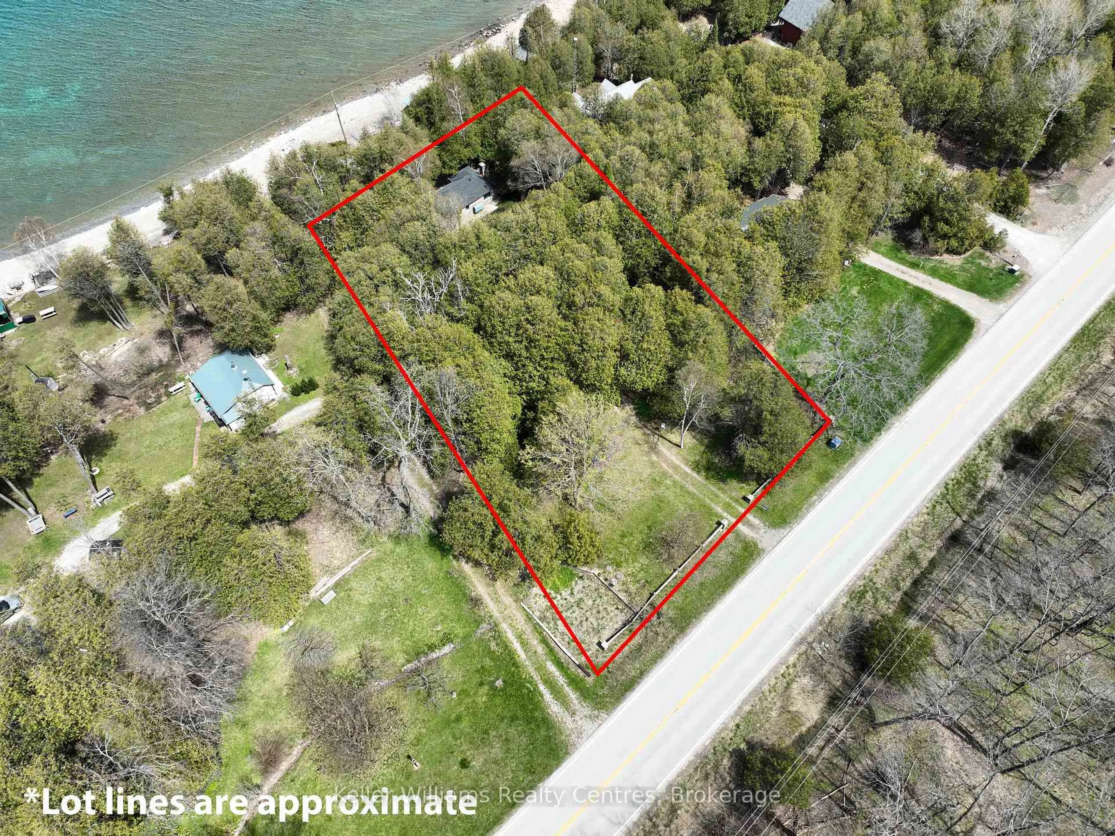 A pic from outside/outdoor area/front of a property/back of a property/a pic from drone, water/lake/river/ocean view for 504215 Grey Road 1, Georgian Bluffs Ontario N0H 2T0