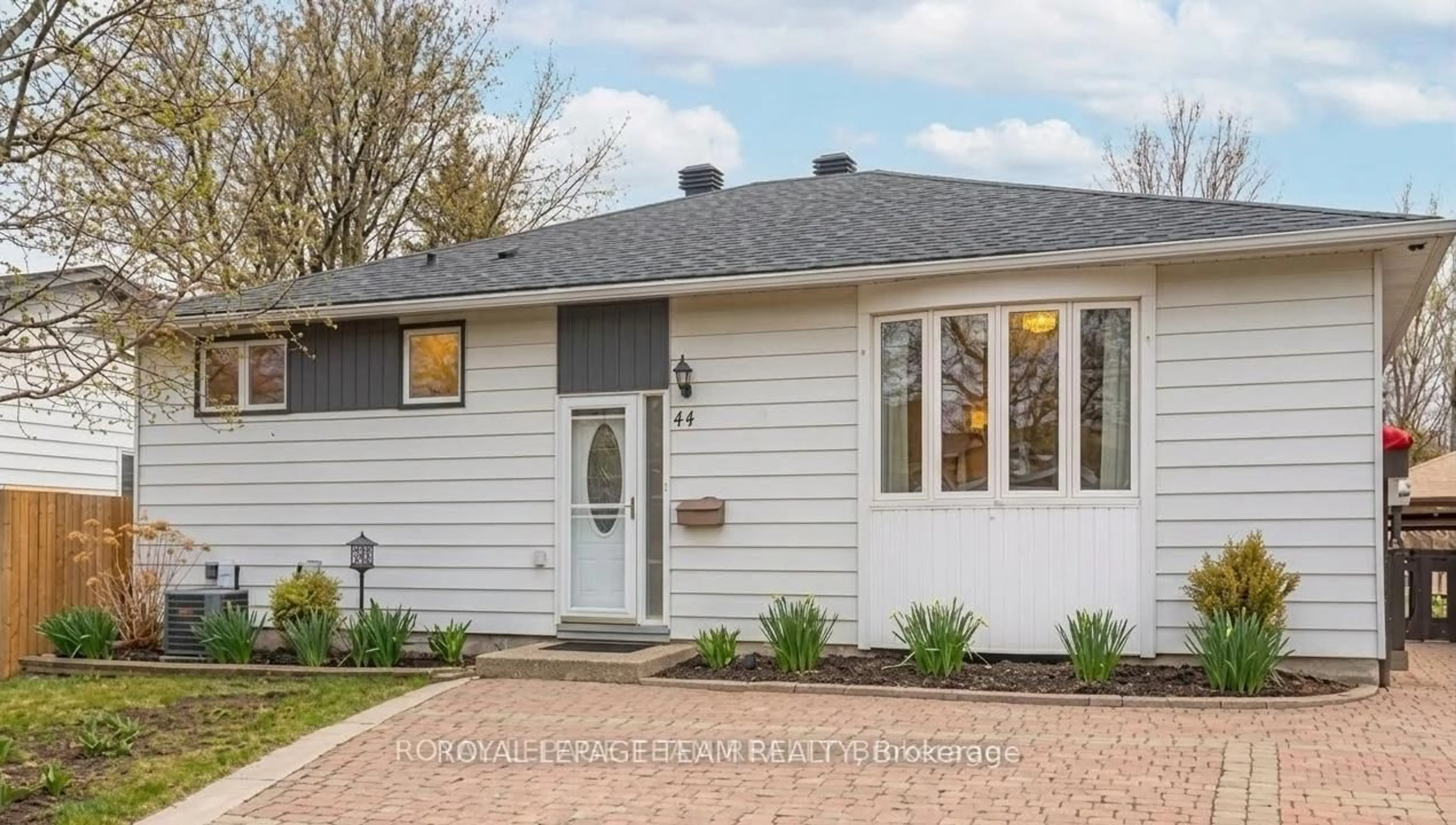 Home with vinyl exterior material, street for 44 Ballantrae Way, Kanata Ontario K2L 1N5