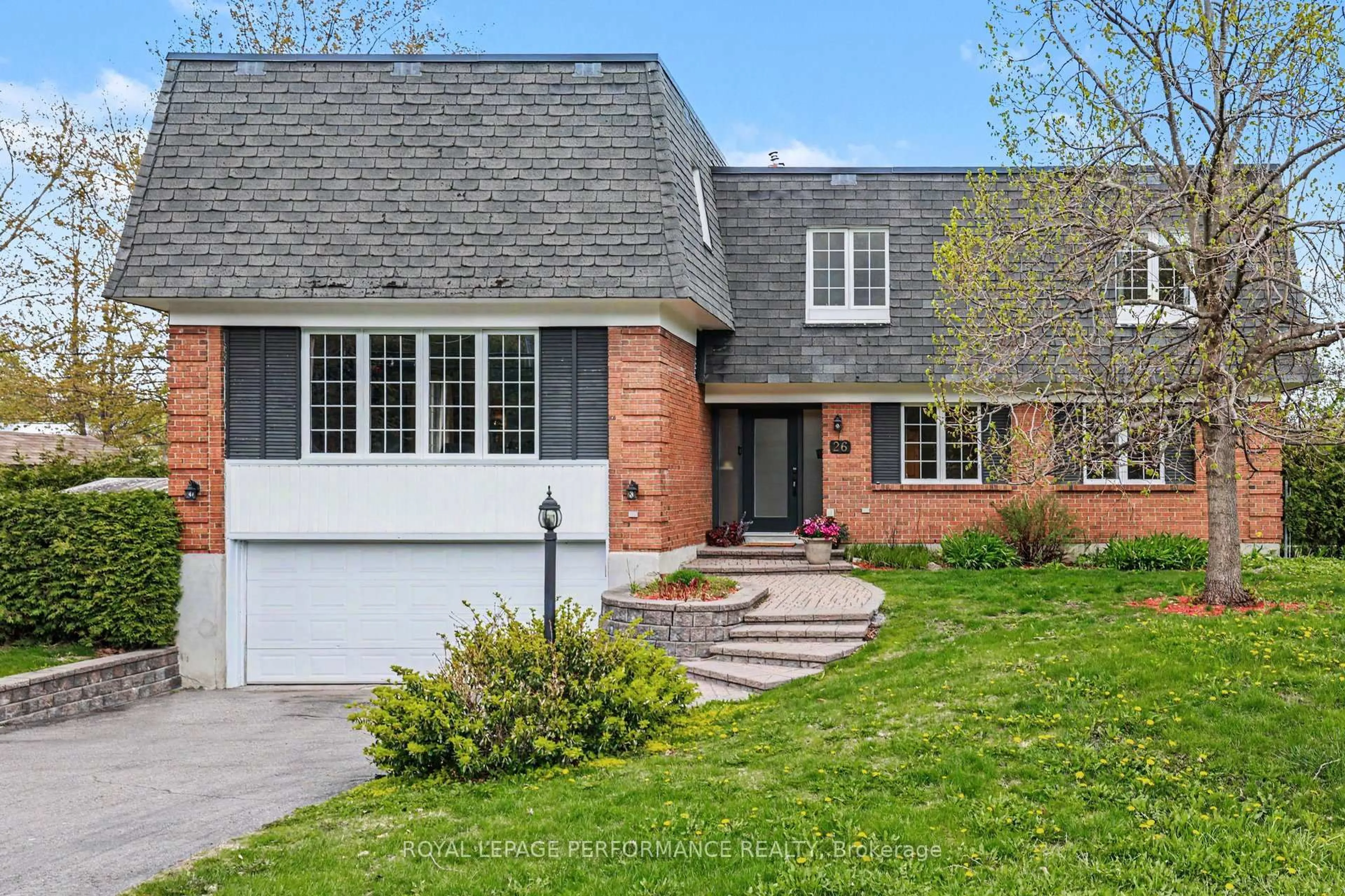 Home with brick exterior material, street for 26 Delong Dr, Ottawa Ontario K1J 8H4