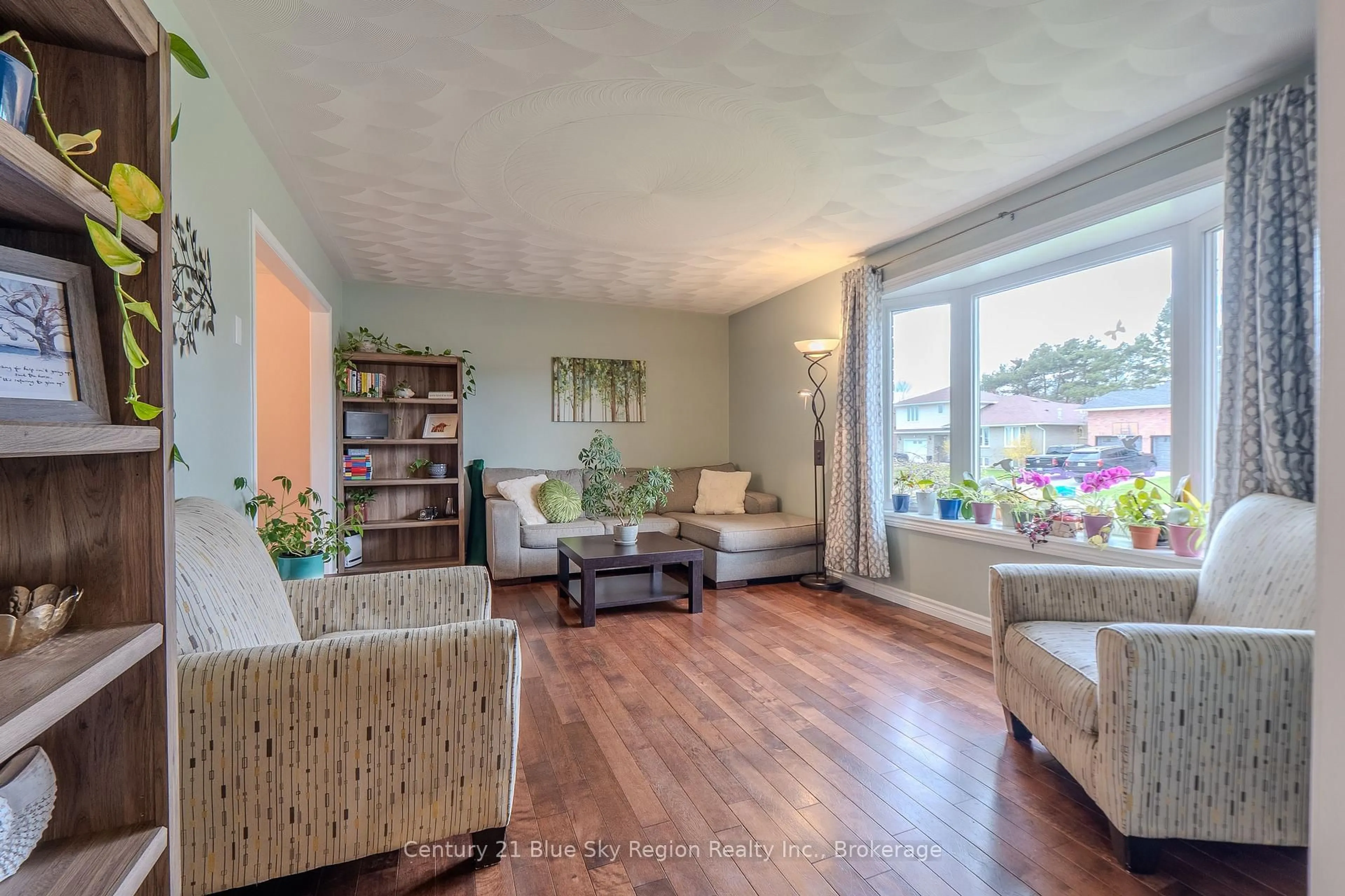 Living room with furniture, wood/laminate floor for 66 Veronica Dr, North Bay Ontario P1B 9K4